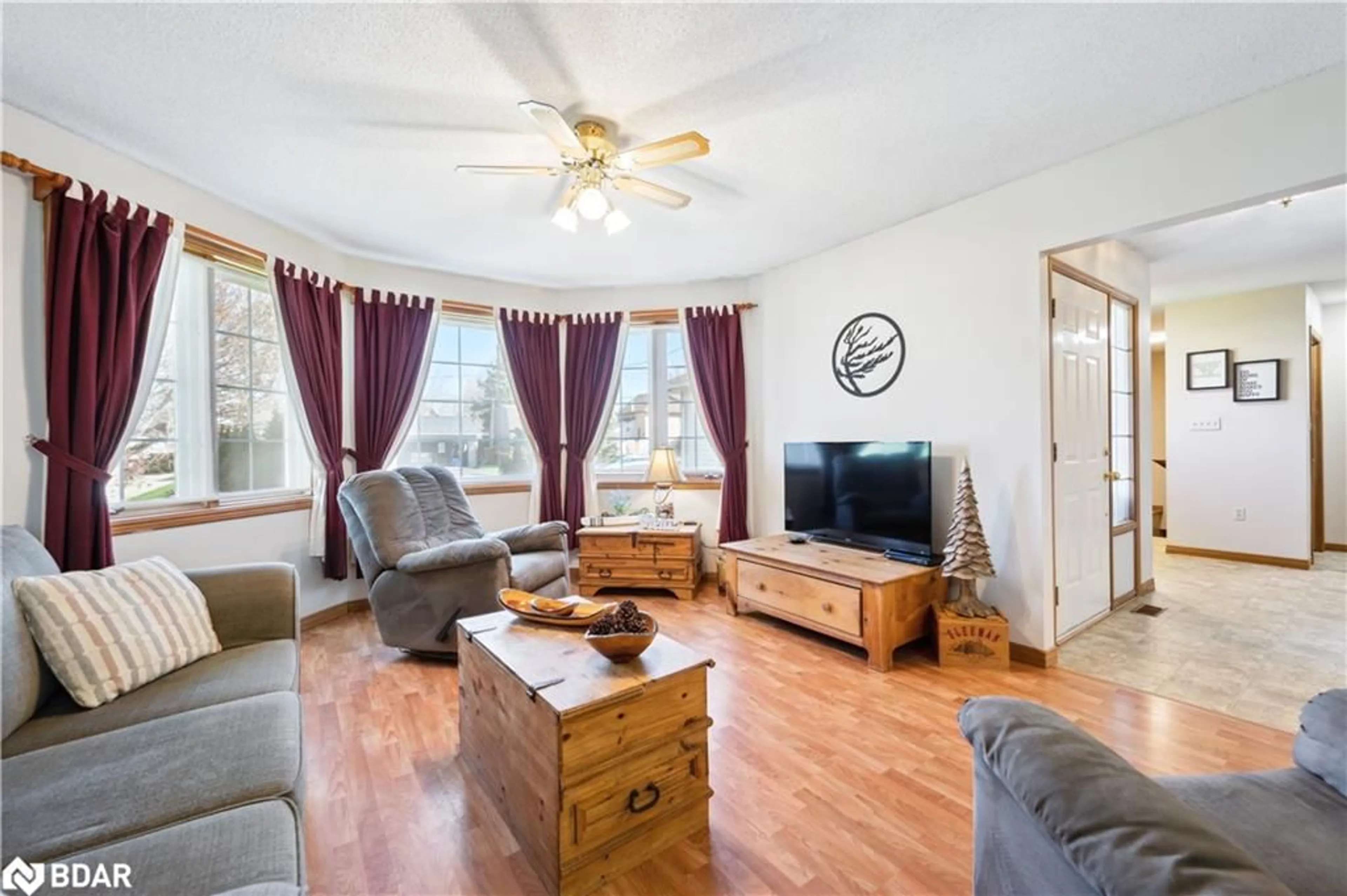 Living room with furniture, wood/laminate floor for 320 Bell St, Palmerston Ontario N0G 2P0