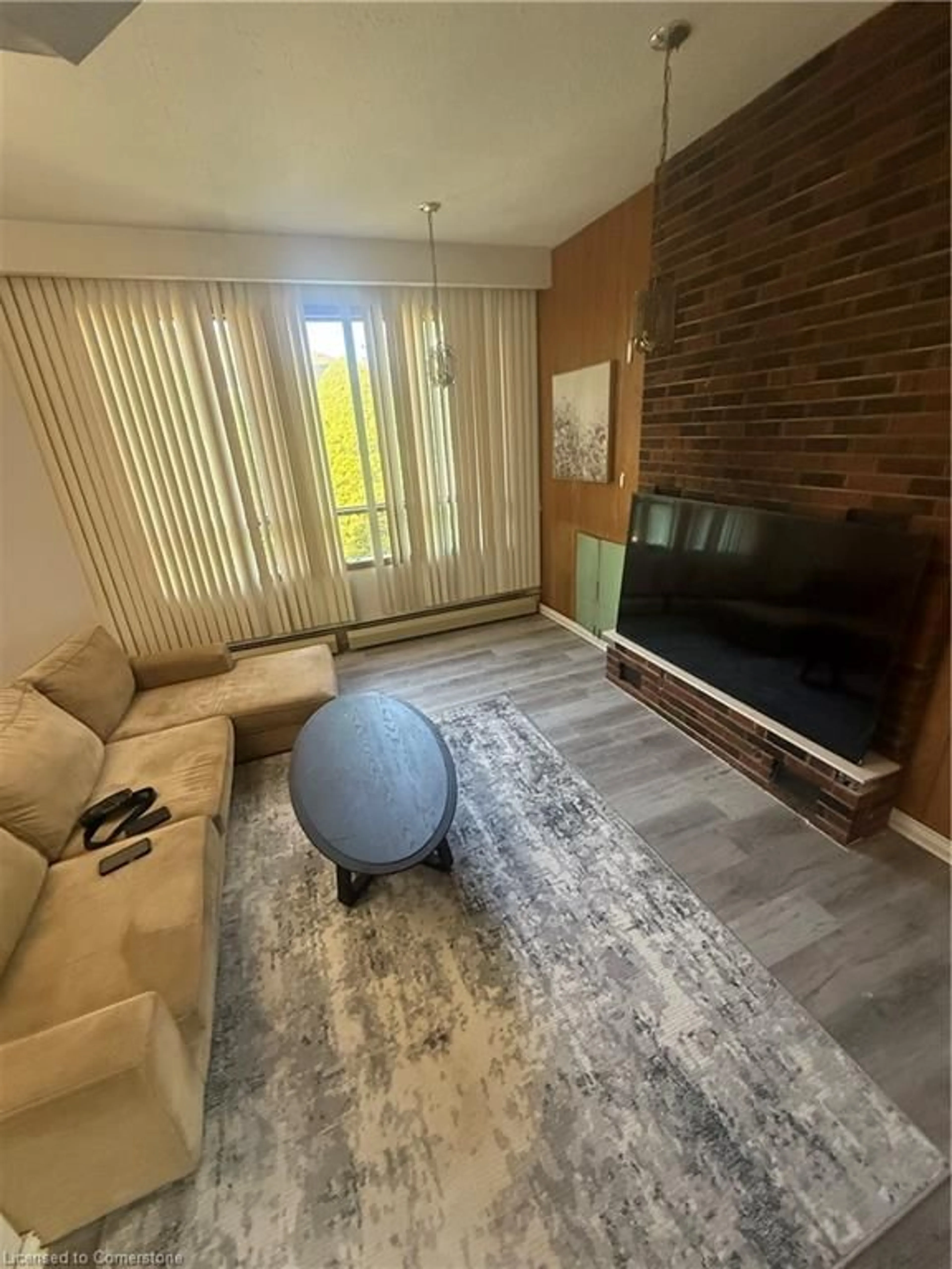 Living room with furniture, unknown for 171 Stone Church Rd, Hamilton Ontario L9B 1A8