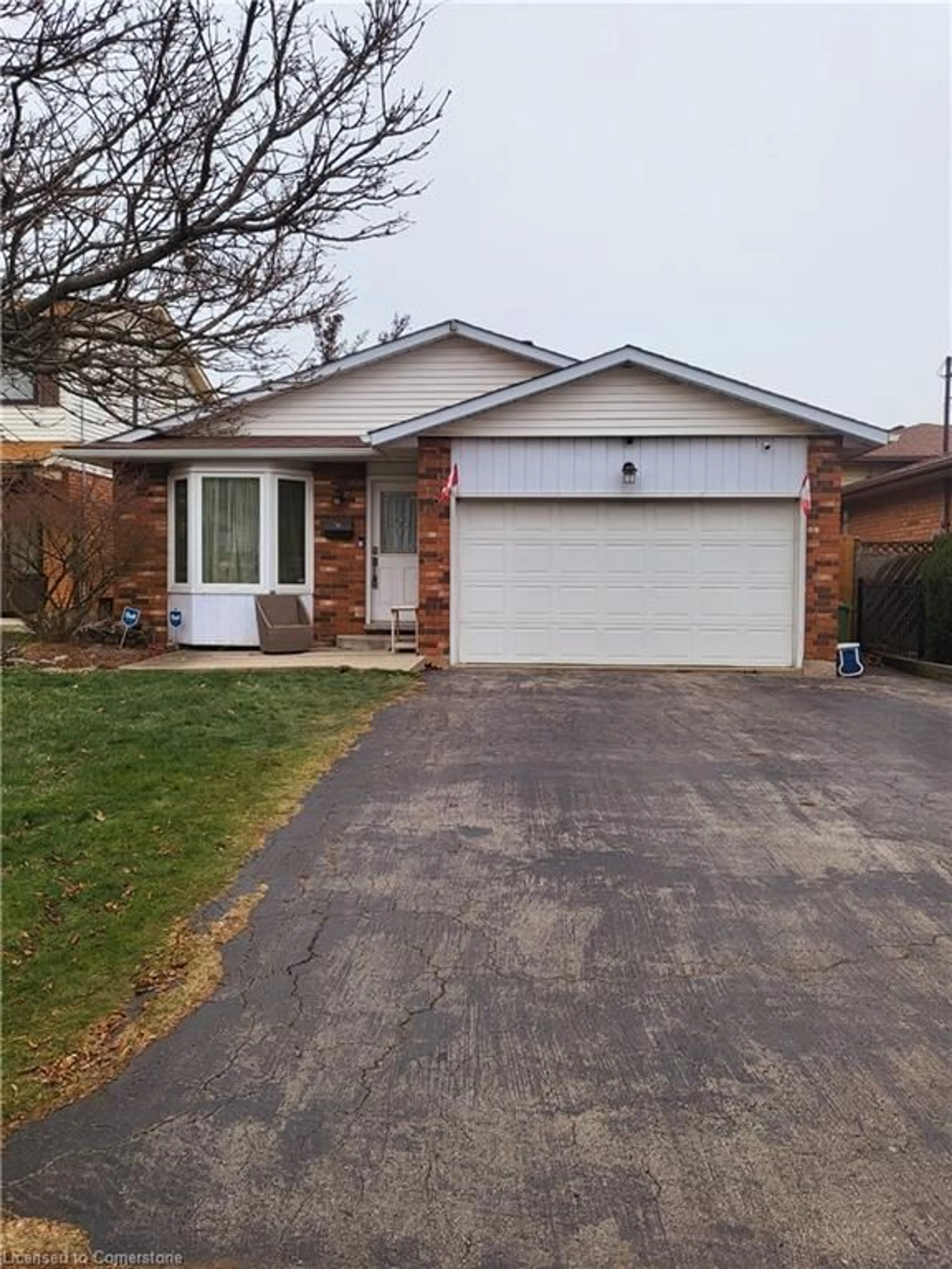 Home with brick exterior material, street for 18 Rosewell St, Hamilton Ontario L8W 2L1