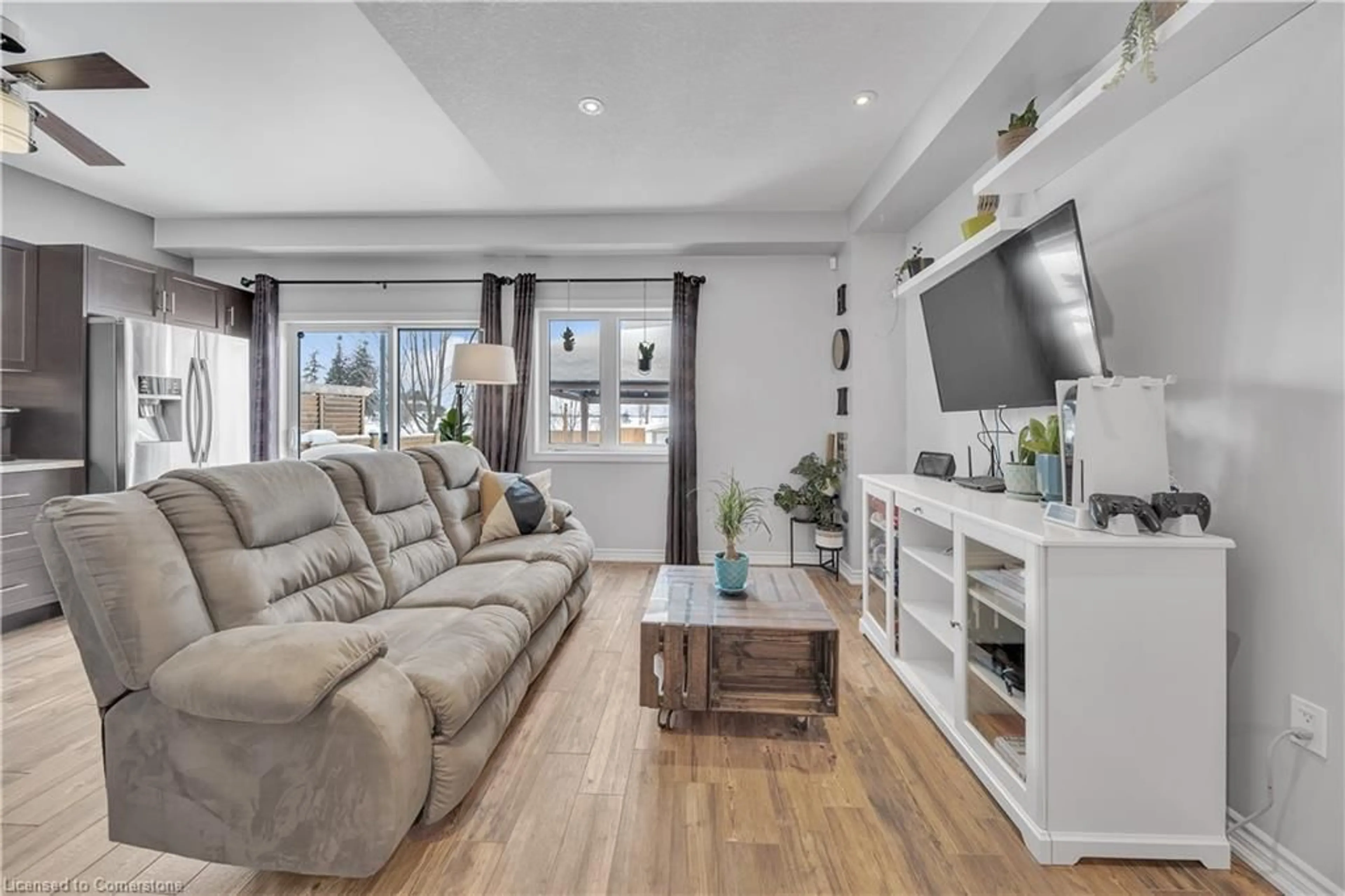 Living room with furniture, wood/laminate floor for 87 Goodall Crt, Fergus Ontario N1M 0C8