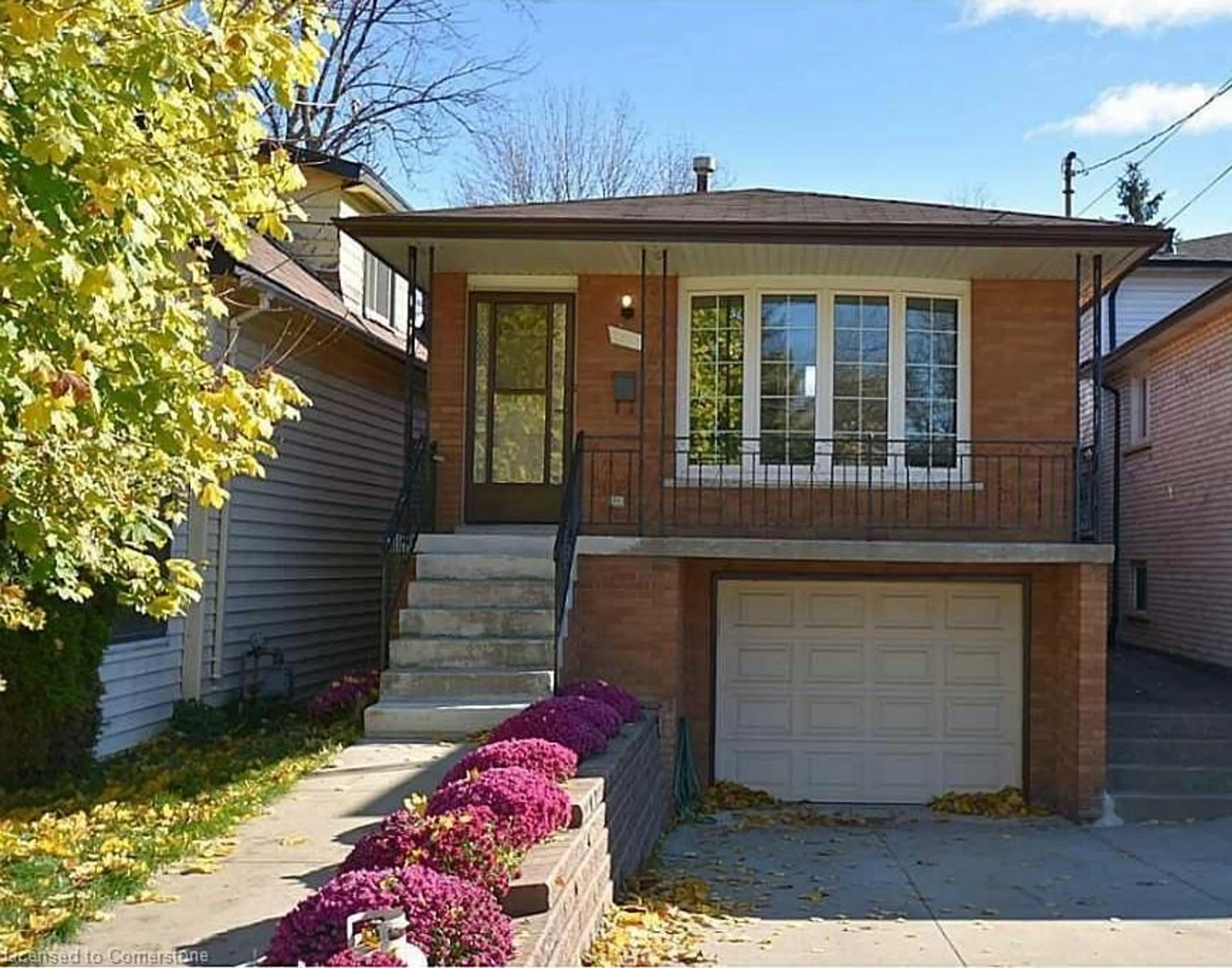 Home with brick exterior material, street for 227 East 8th St, Hamilton Ontario L9A 3L7