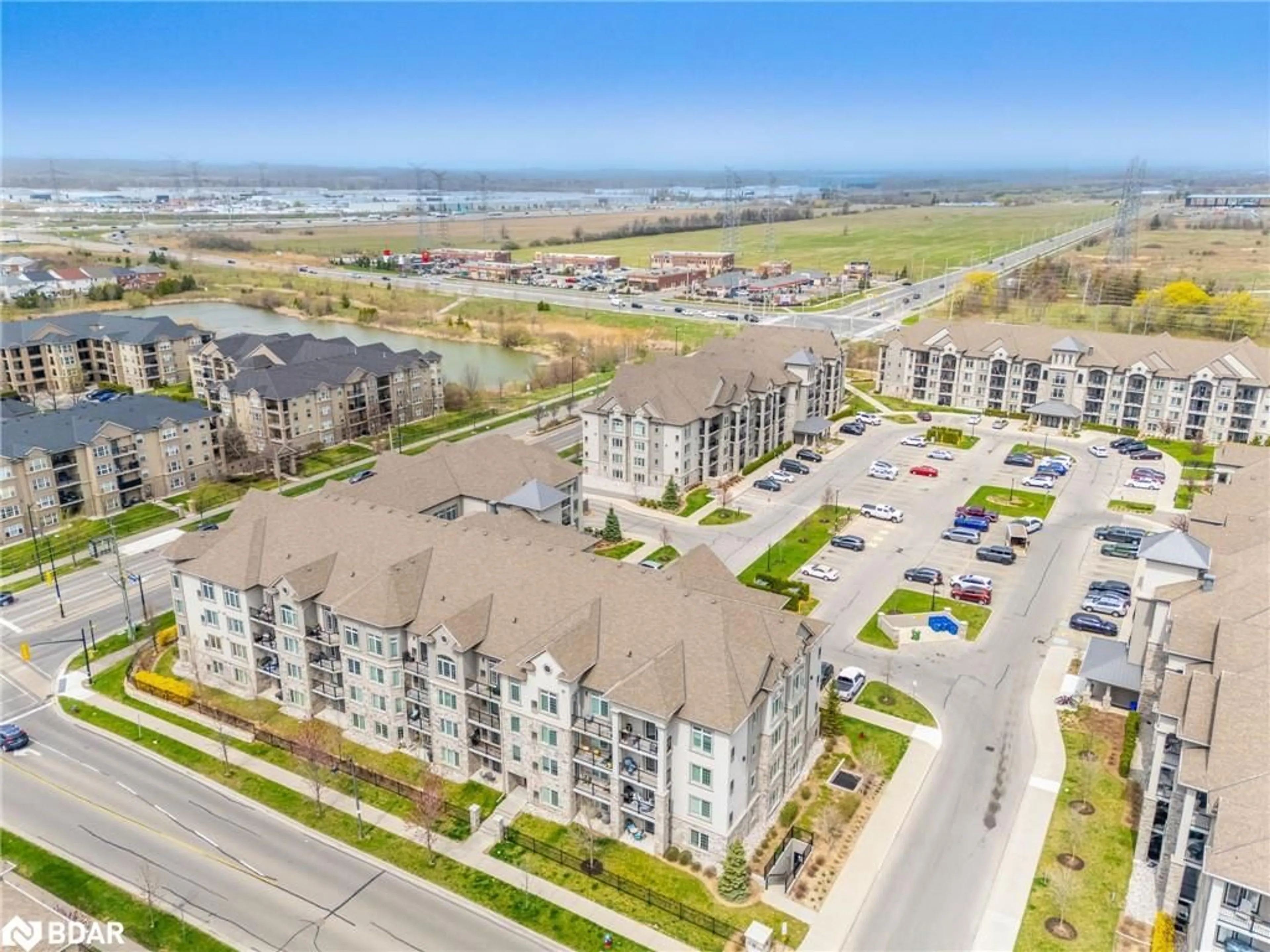 A pic from outside/outdoor area/front of a property/back of a property/a pic from drone, water/lake/river/ocean view for 1440 Main St #415, Milton Ontario L9T 8W3