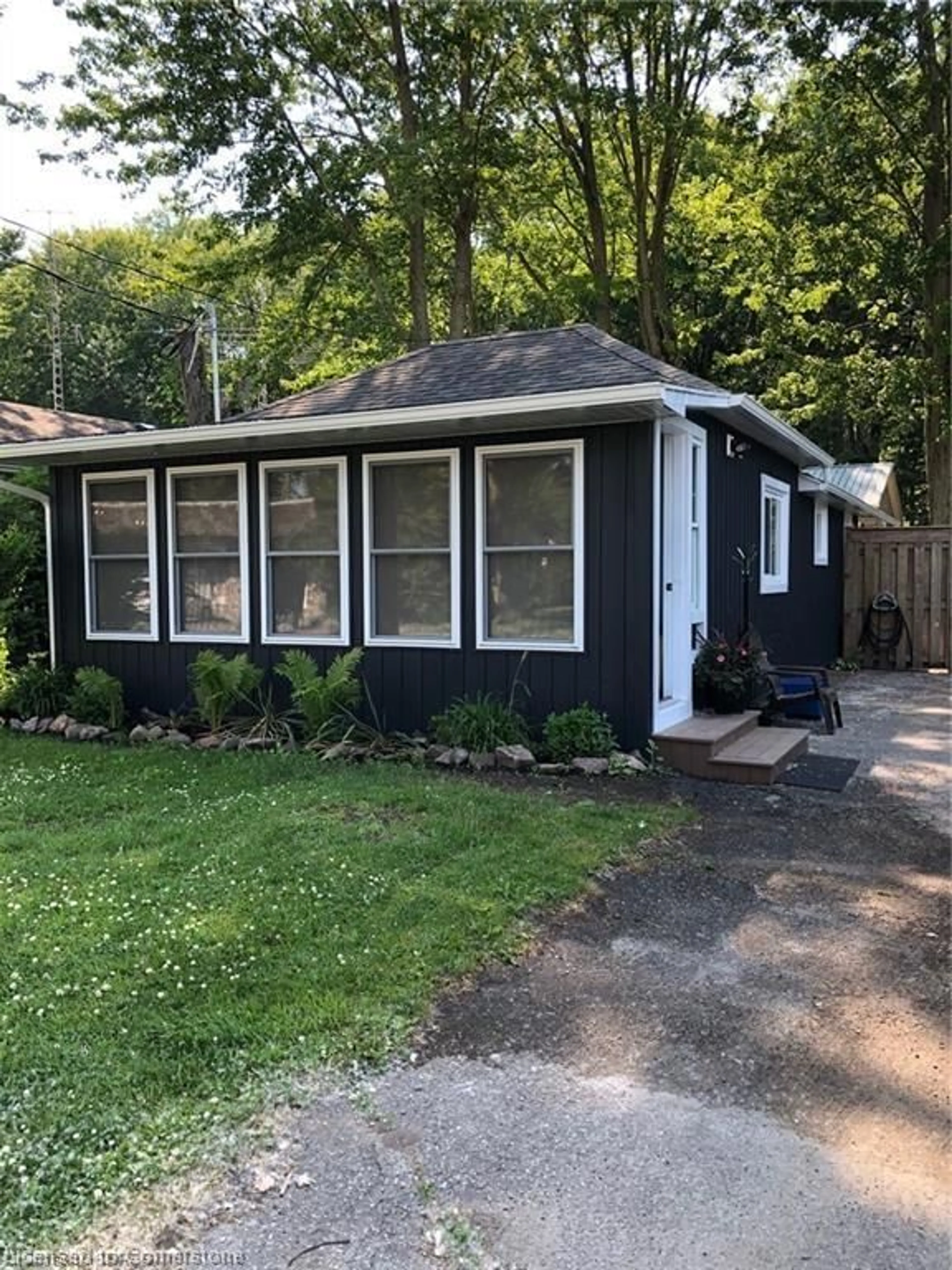Home with vinyl exterior material, street for 219 Cedar Dr, Turkey Point Ontario N0E 1T0