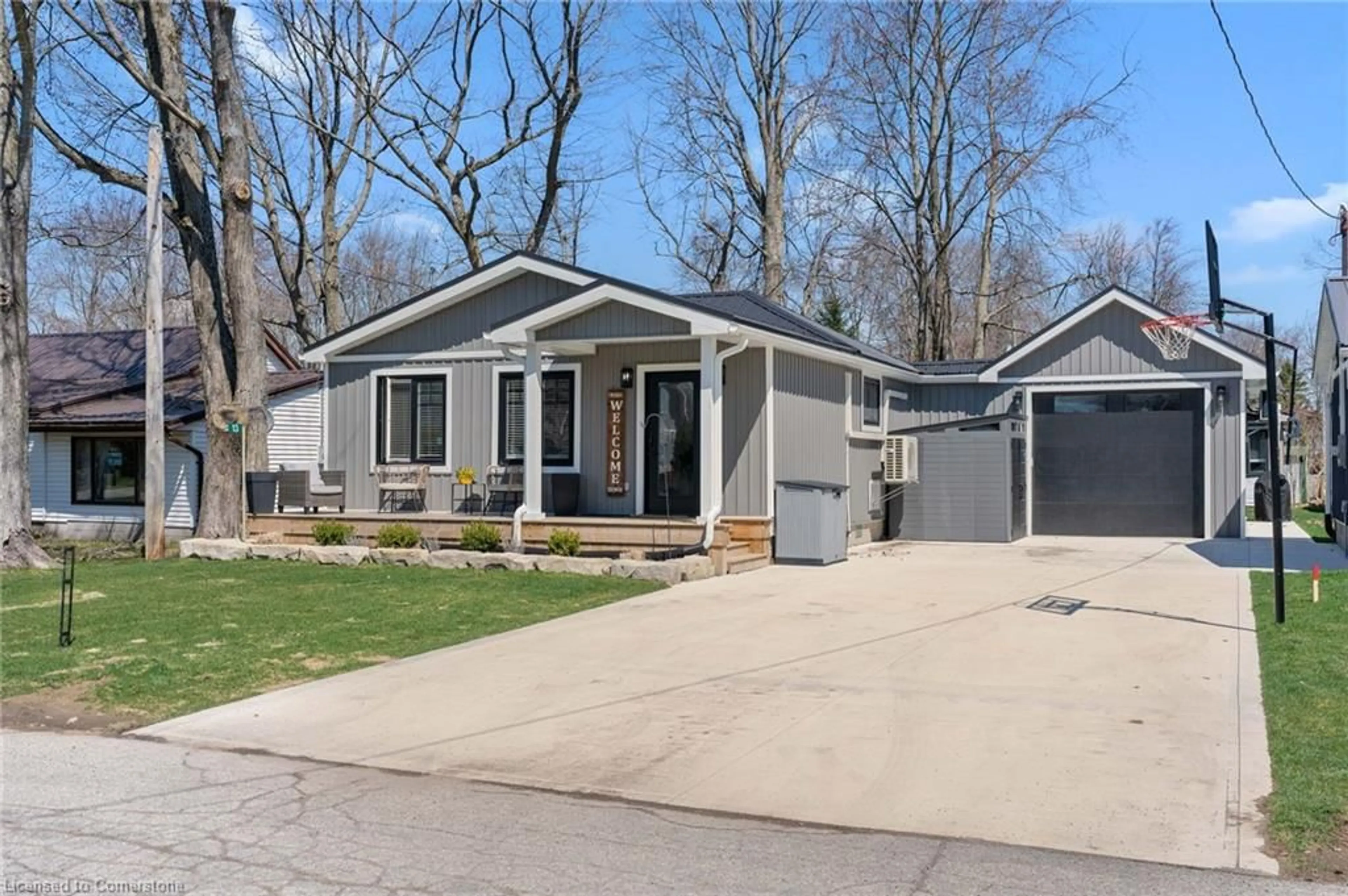 Home with vinyl exterior material, street for 13 Walmsley St, Turkey Point Ontario N0E 1T0