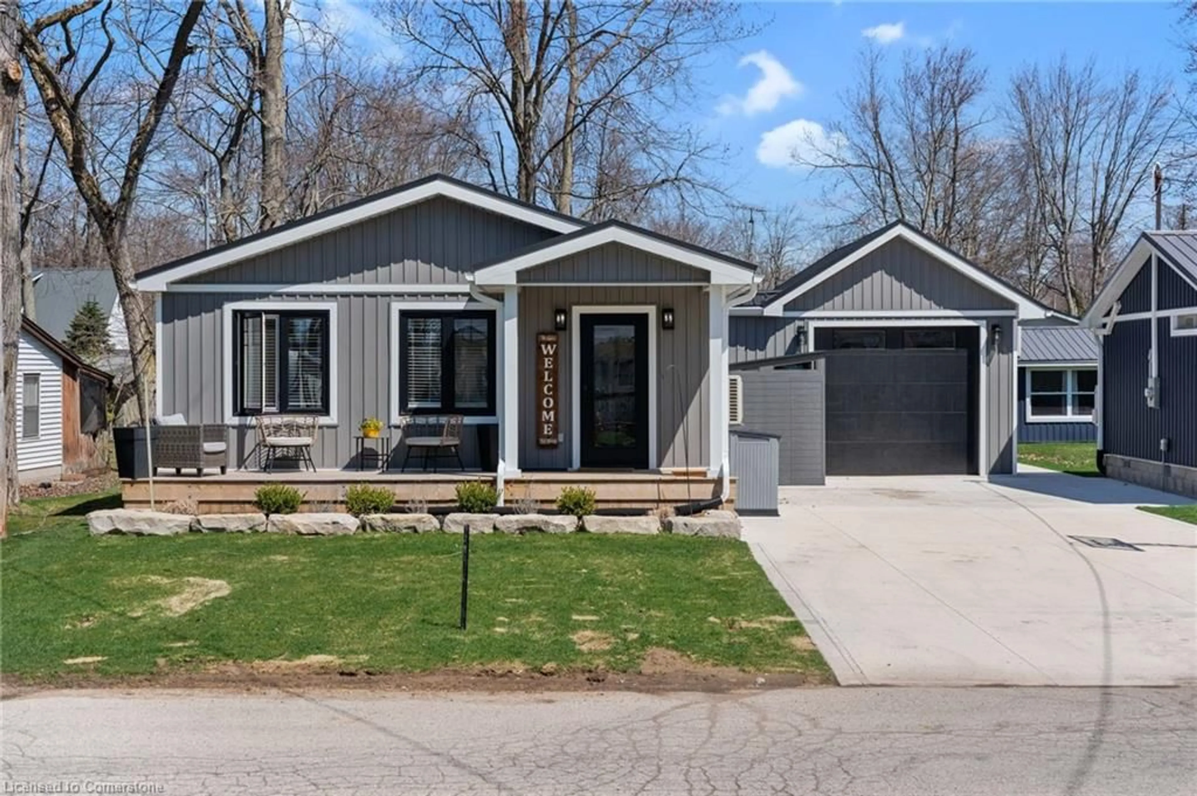 Home with vinyl exterior material, street for 13 Walmsley St, Turkey Point Ontario N0E 1T0