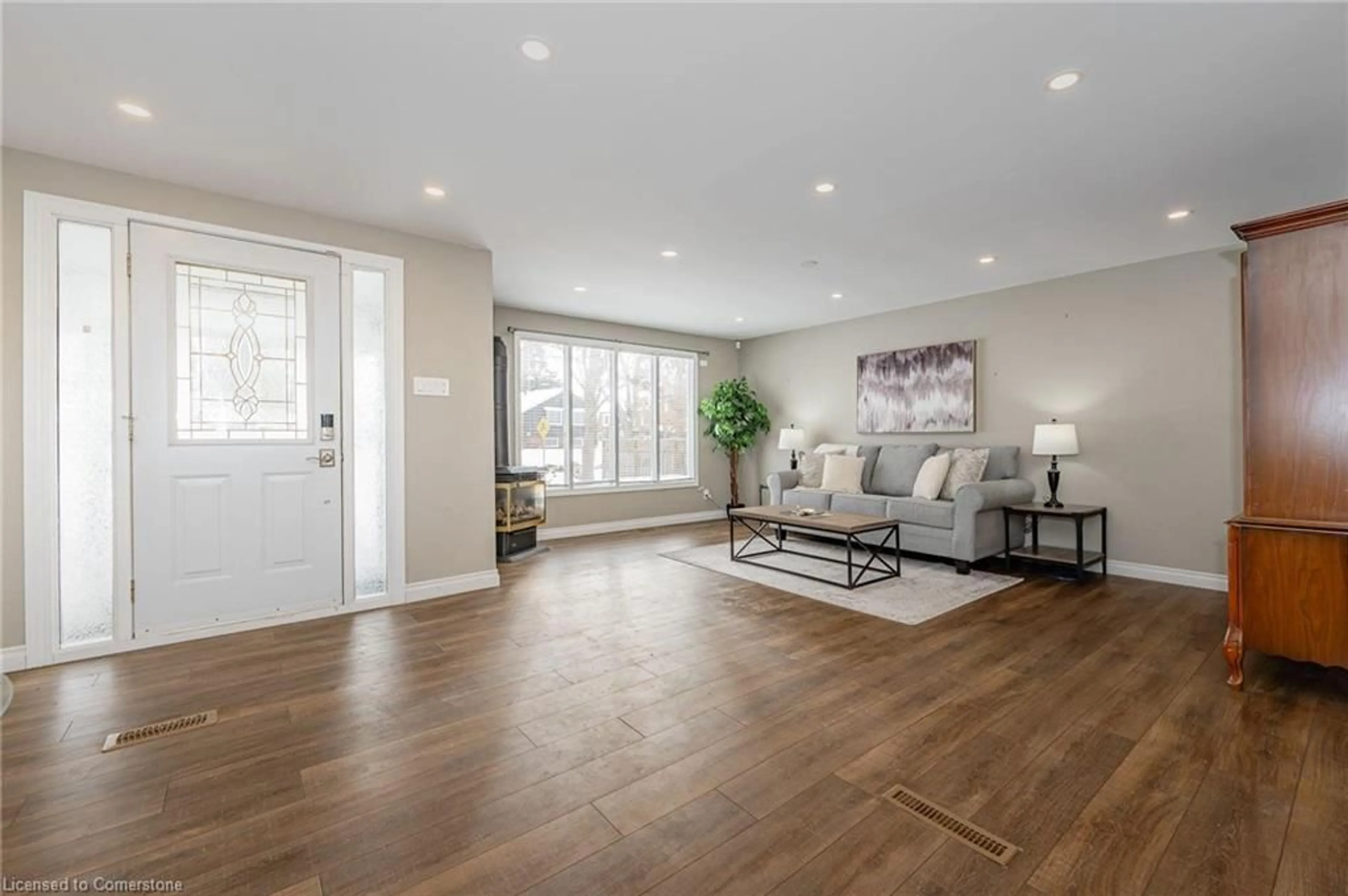 Living room with furniture, wood/laminate floor for 6 Stirling Pl, Guelph Ontario N1H 6W2