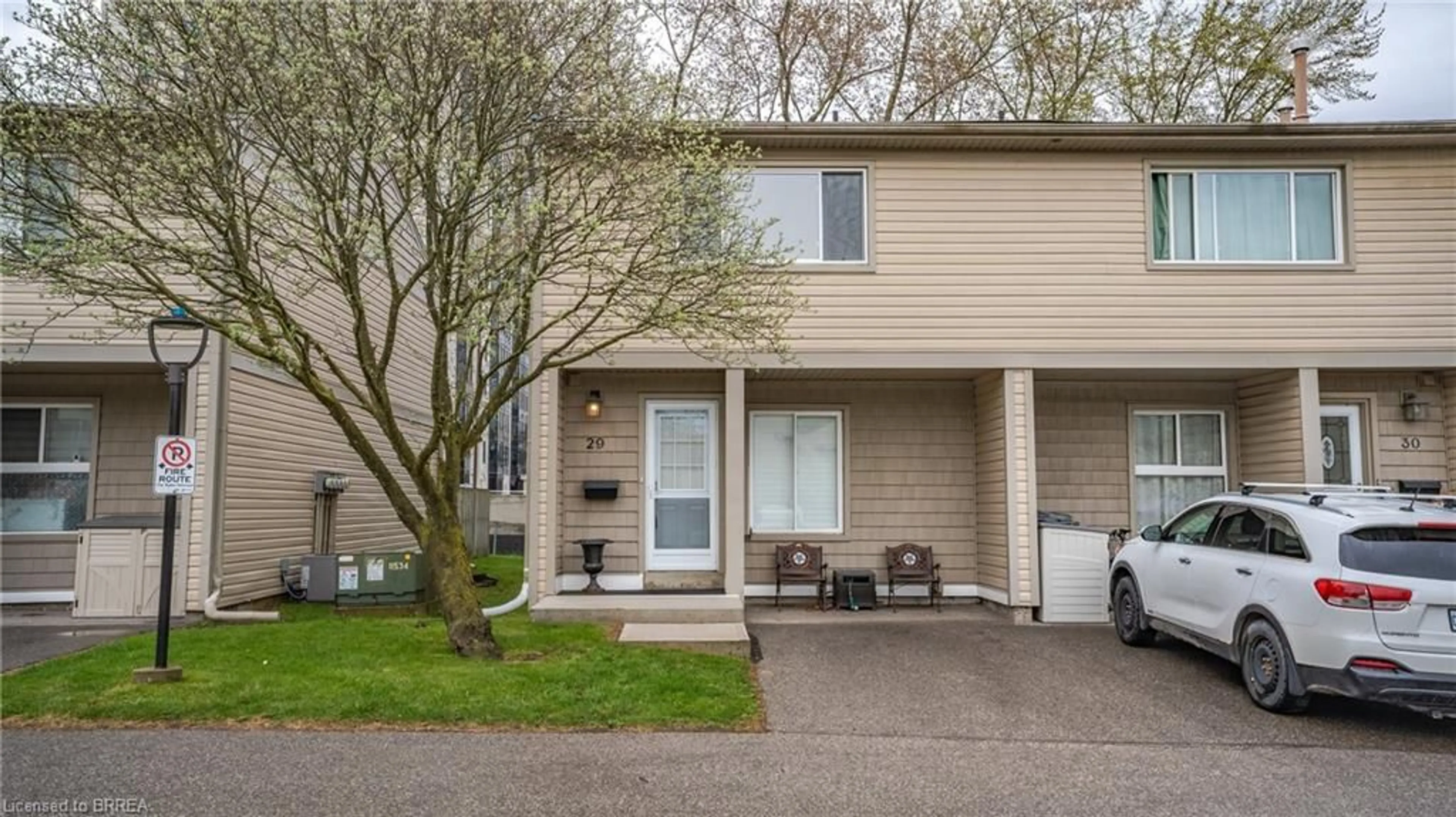 Home with vinyl exterior material, street for 15 Green Valley Dr #29, Kitchener Ontario N2P 1K7
