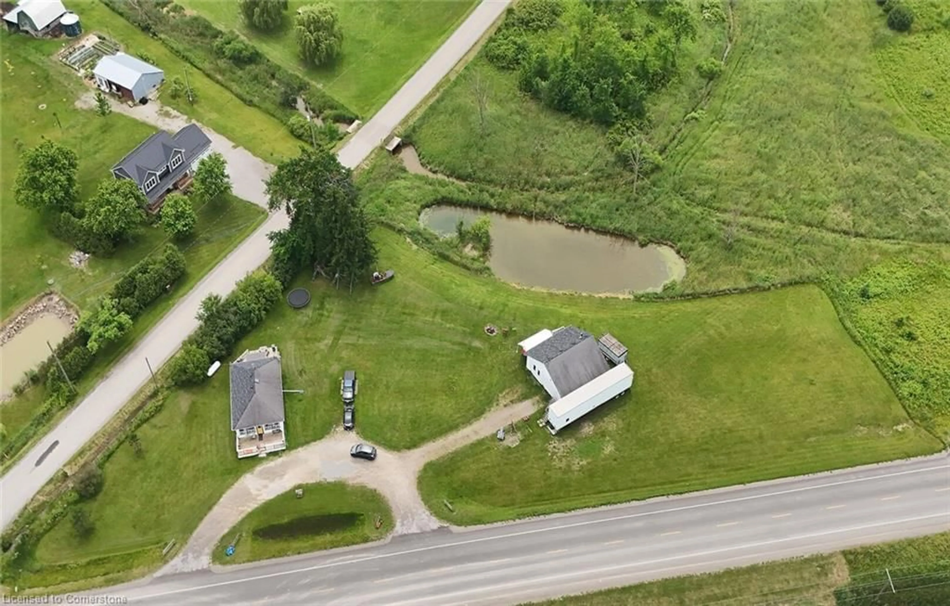 A pic from outside/outdoor area/front of a property/back of a property/a pic from drone, unknown for 1008 #27 Regional Rd, Wellandport Ontario L0R 2J0