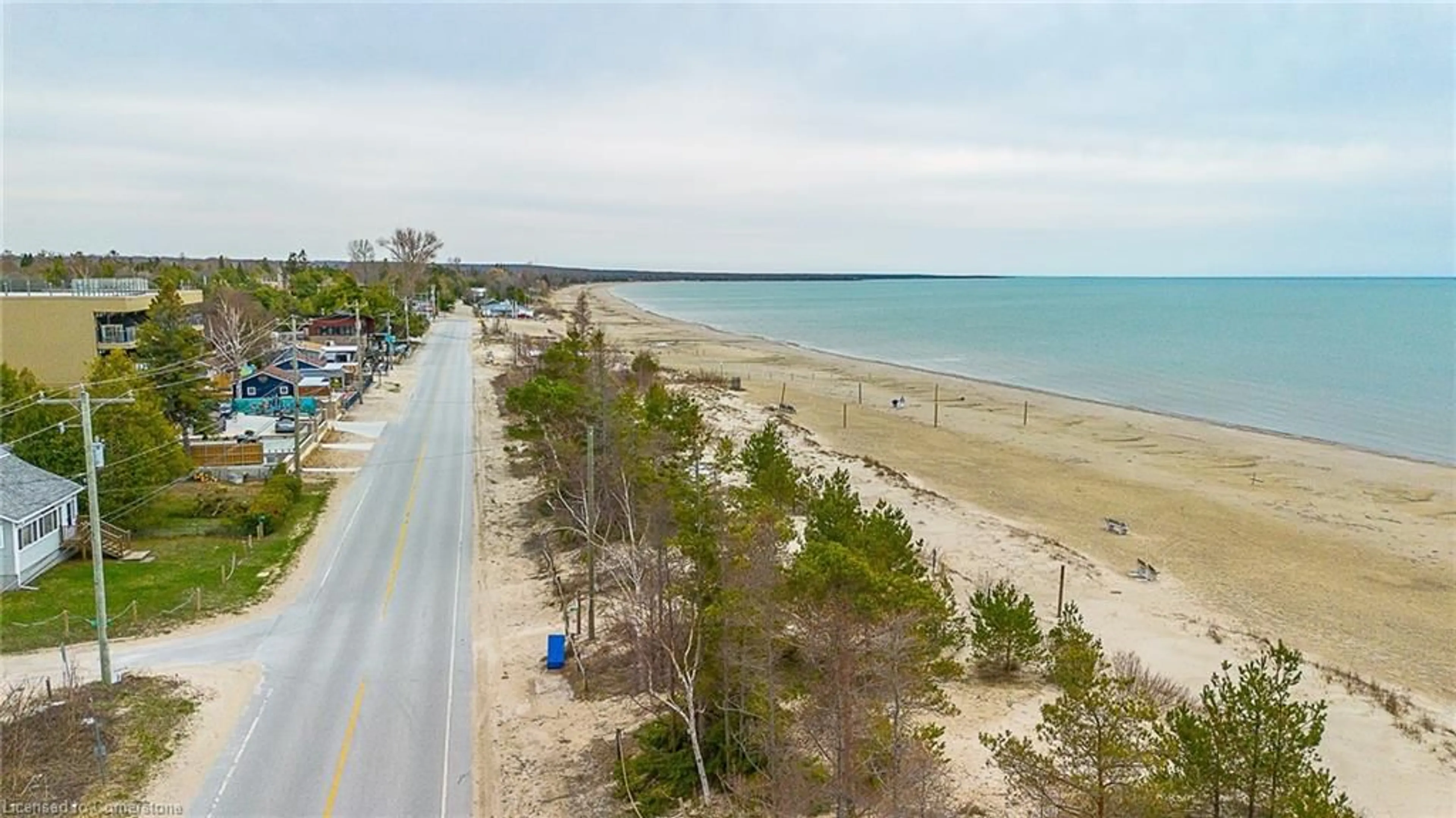 A pic from outside/outdoor area/front of a property/back of a property/a pic from drone, water/lake/river/ocean view for 4 Toronto Ave Ave, Sauble Beach Ontario N0H 2G0