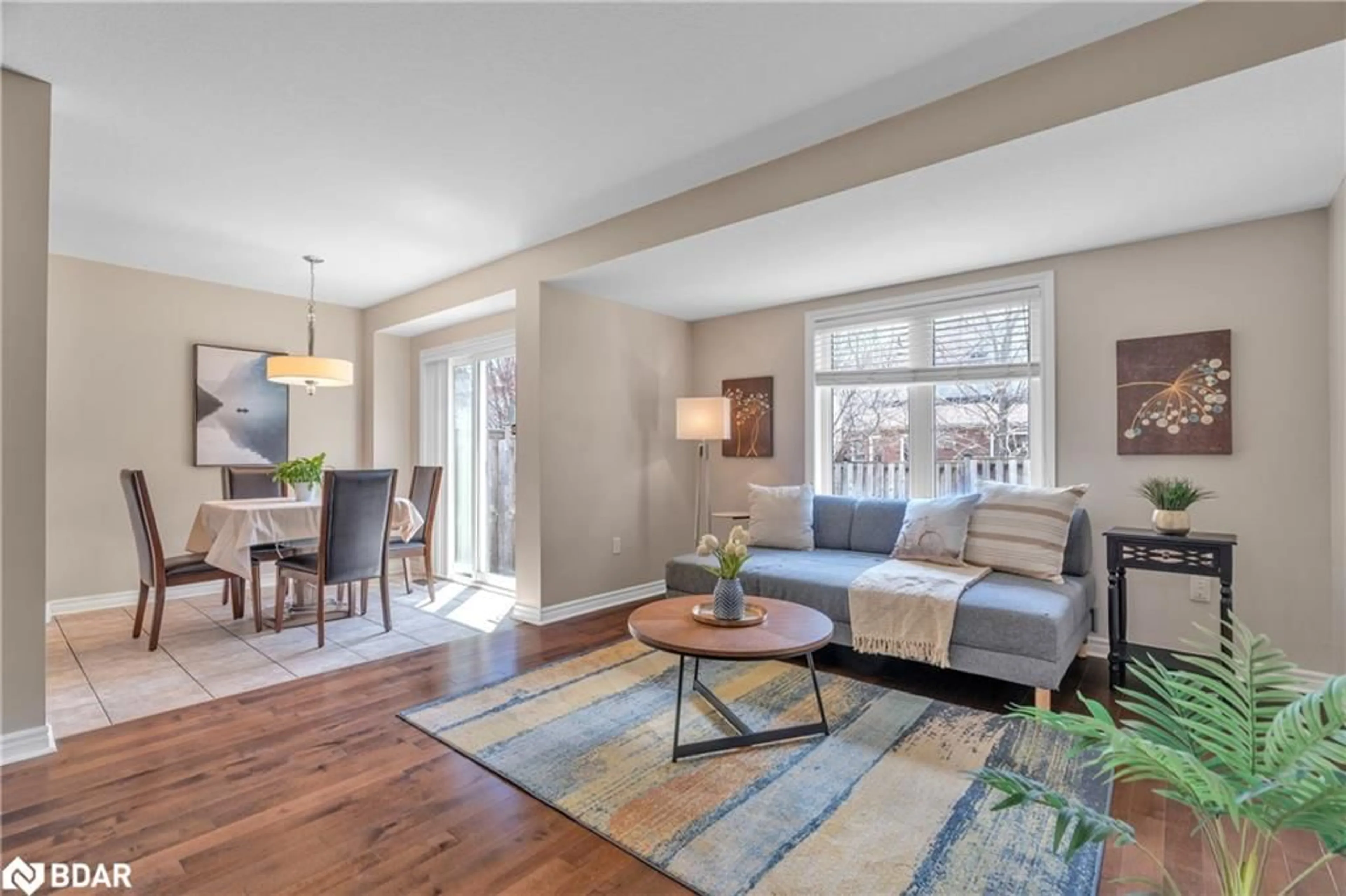 Living room with furniture, wood/laminate floor for 11 Revell Dr, Guelph Ontario N1G 0B2