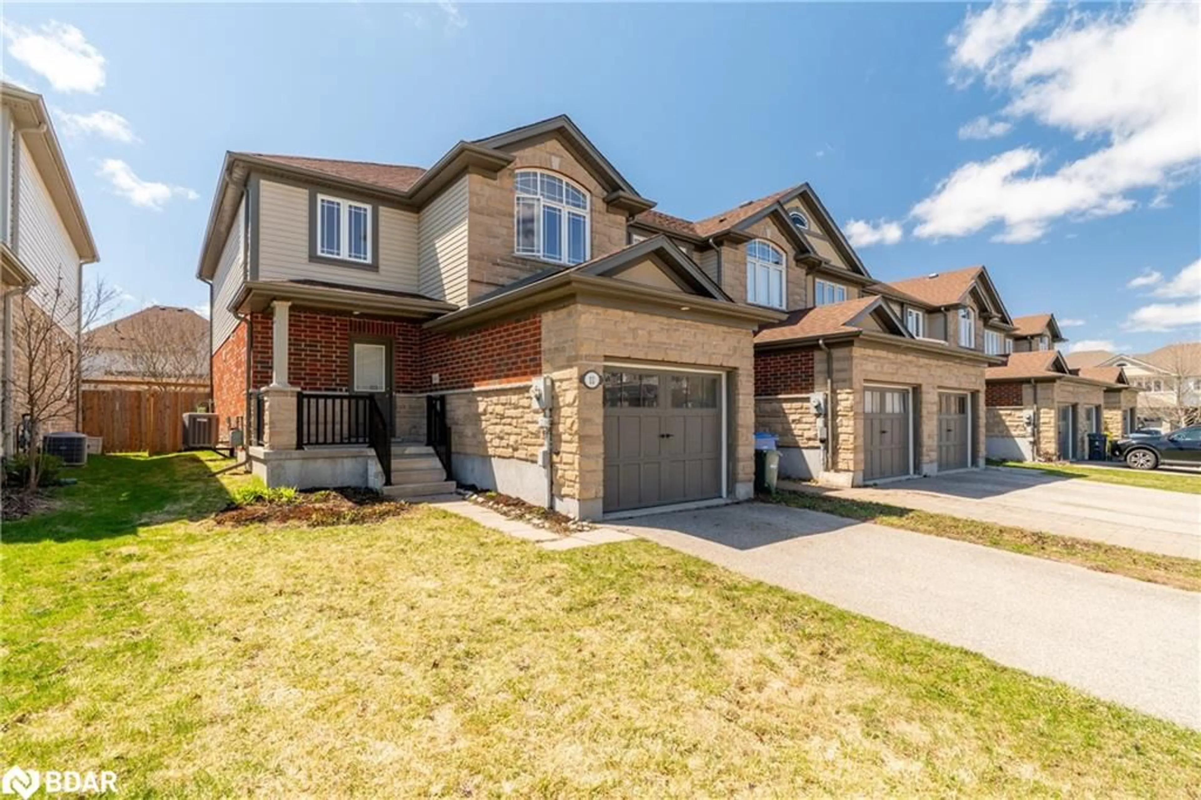Home with brick exterior material, street for 11 Revell Dr, Guelph Ontario N1G 0B2