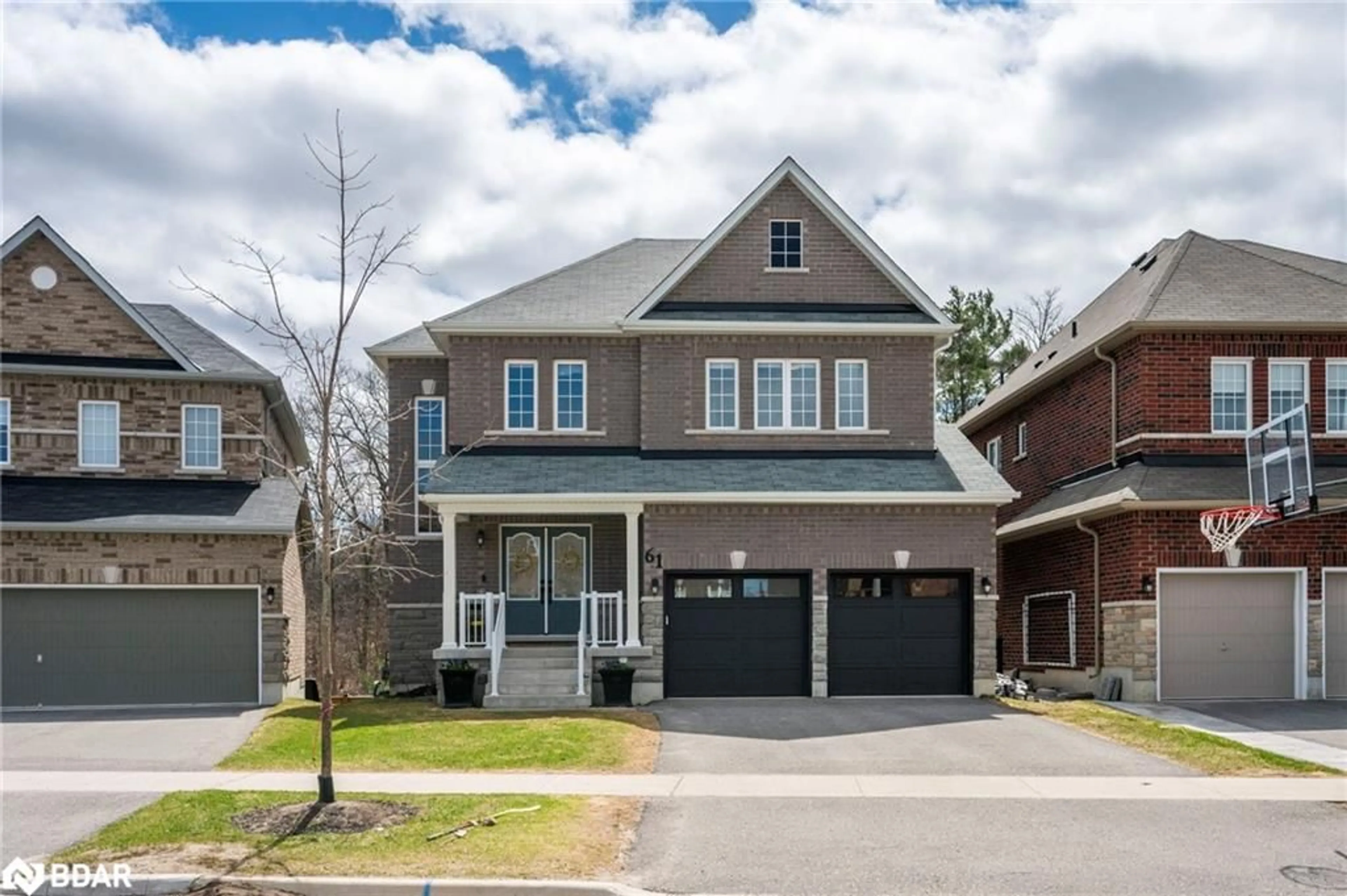 Home with brick exterior material, street for 61 Muirfield Drive Dr, Barrie Ontario L4N 6J9