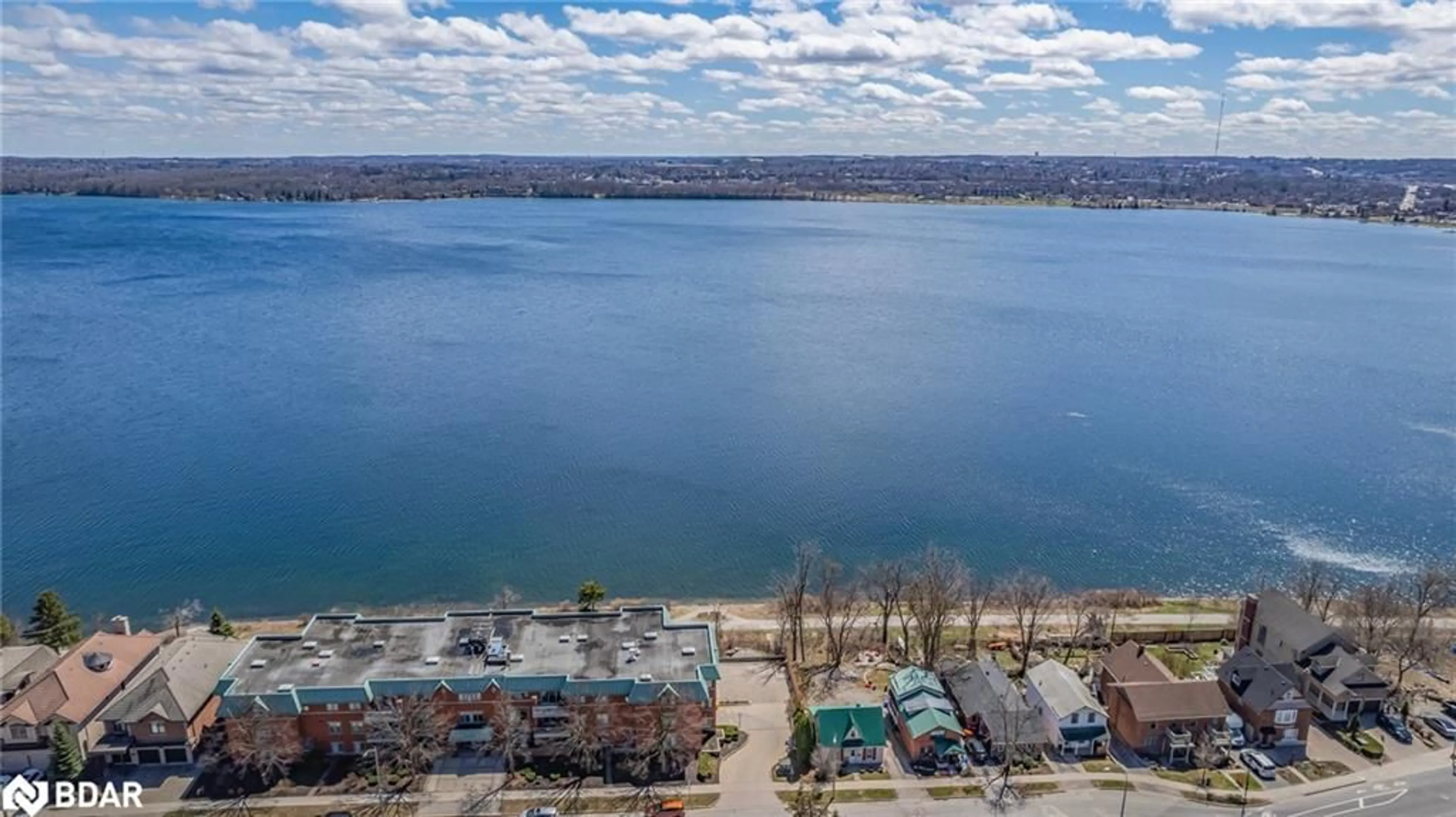 A pic from outside/outdoor area/front of a property/back of a property/a pic from drone, water/lake/river/ocean view for 2 Albert St #32, Barrie Ontario L4M 3S4