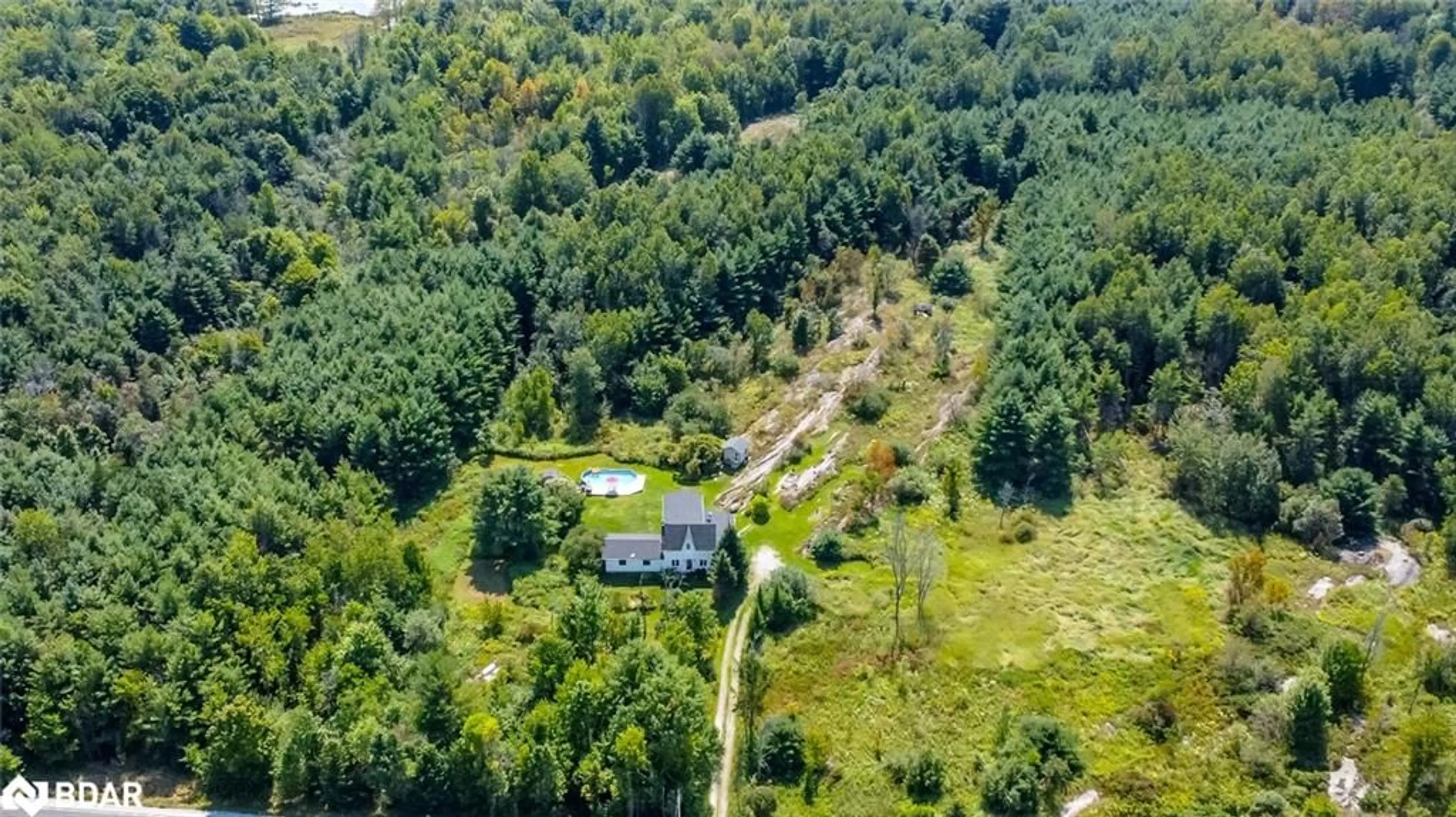 A pic from outside/outdoor area/front of a property/back of a property/a pic from drone, forest/trees view for 2161 Coopers Falls Rd, Washago Ontario L0K 2B0