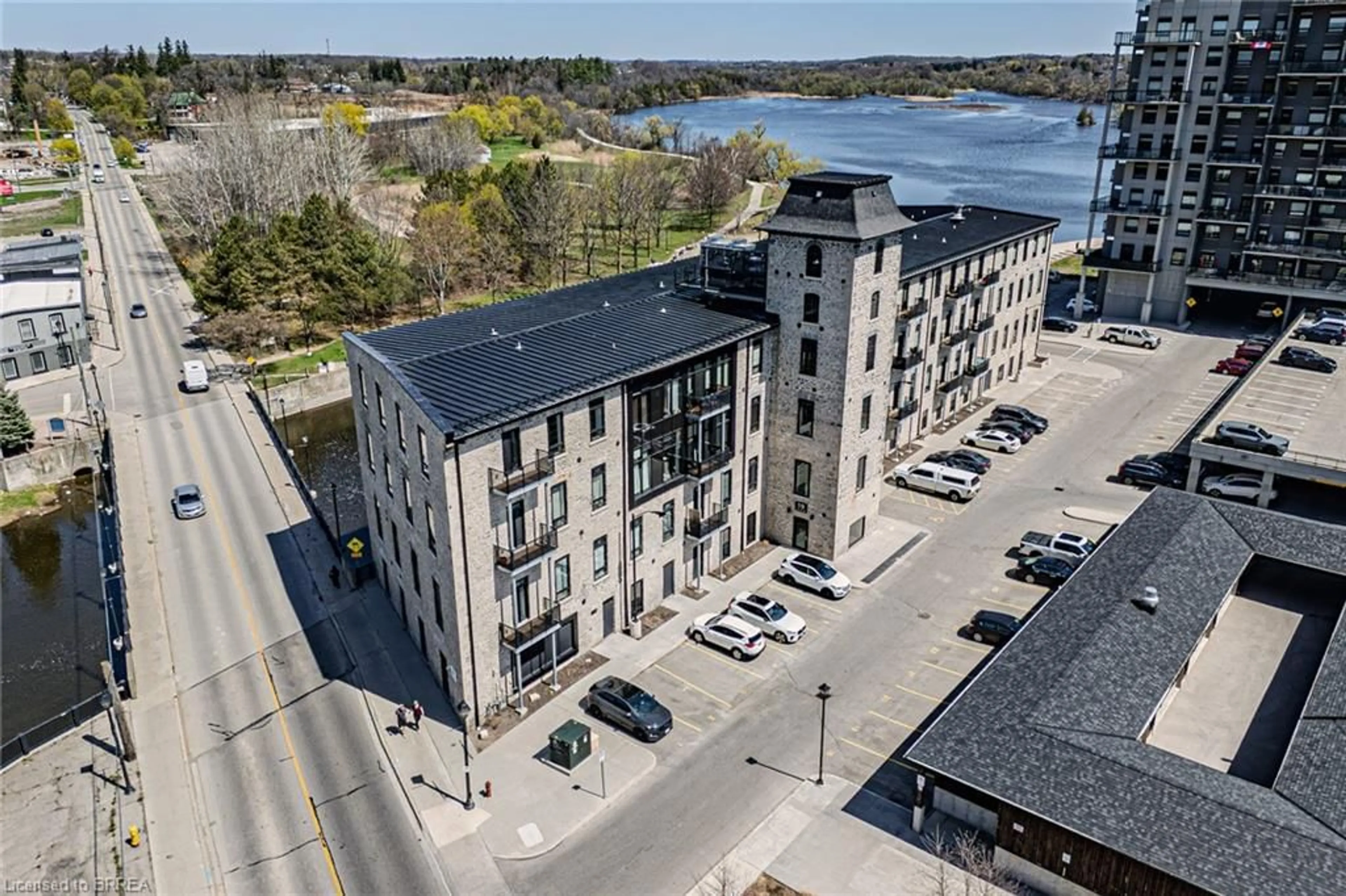 A pic from outside/outdoor area/front of a property/back of a property/a pic from drone, water/lake/river/ocean view for 19 Guelph Ave #105, Cambridge Ontario N3C 1A2