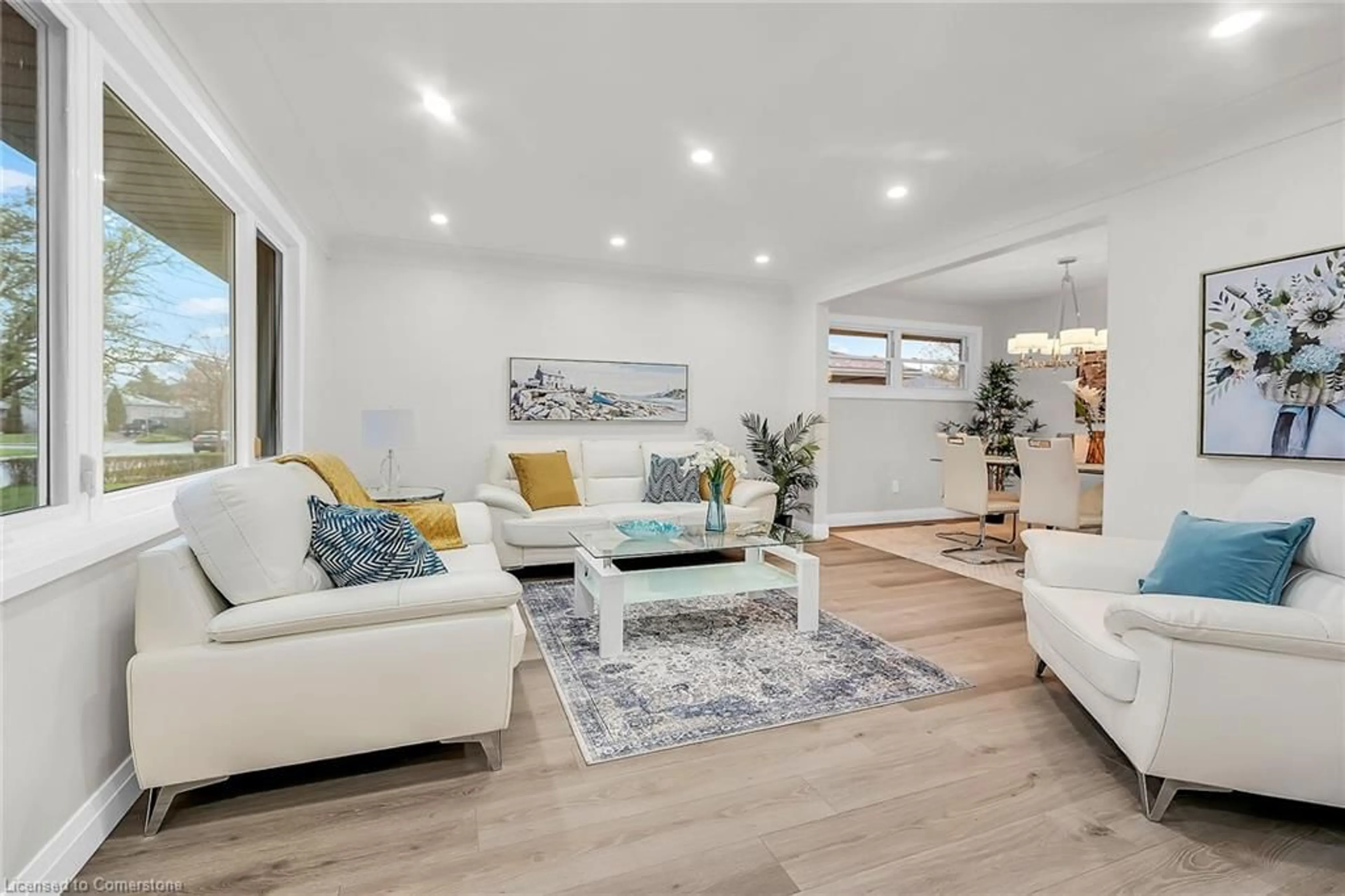 Living room with furniture, wood/laminate floor for 115 Mcelroy Rd, Hamilton Ontario L9A 1Z1