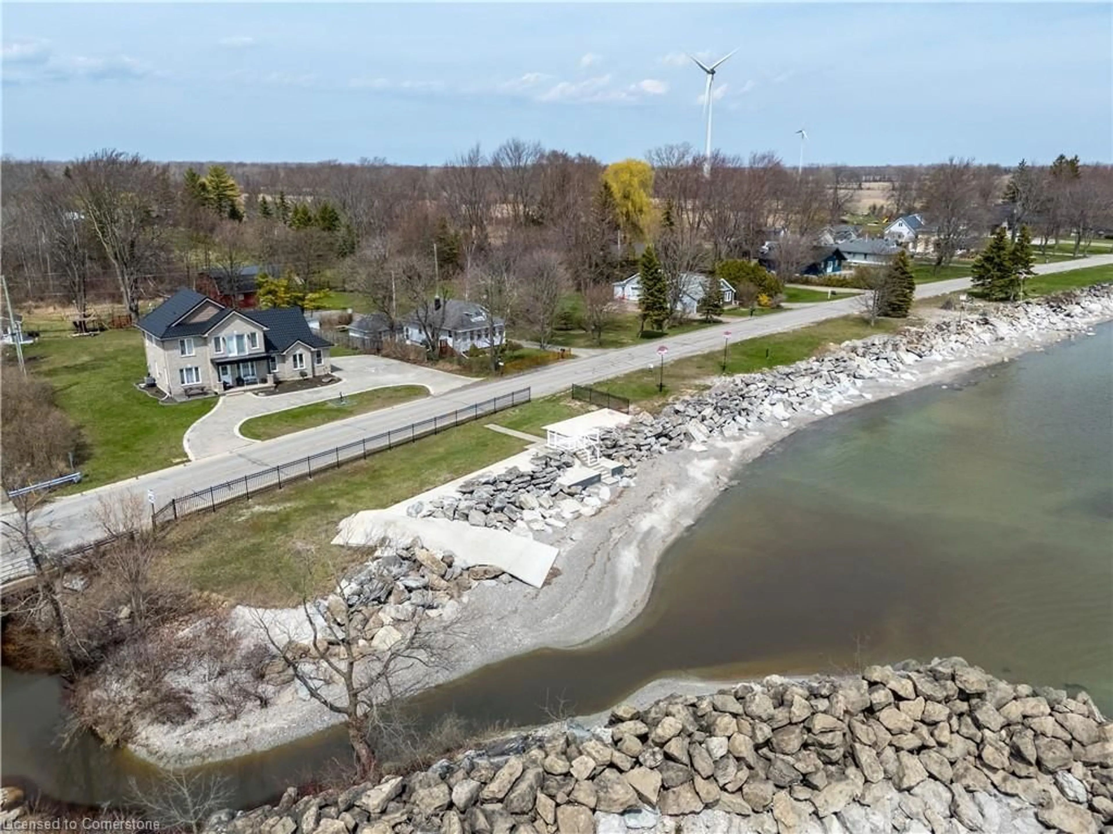 A pic from outside/outdoor area/front of a property/back of a property/a pic from drone, water/lake/river/ocean view for 2801 North Shore Dr, Lowbanks Ontario N0A 1K0