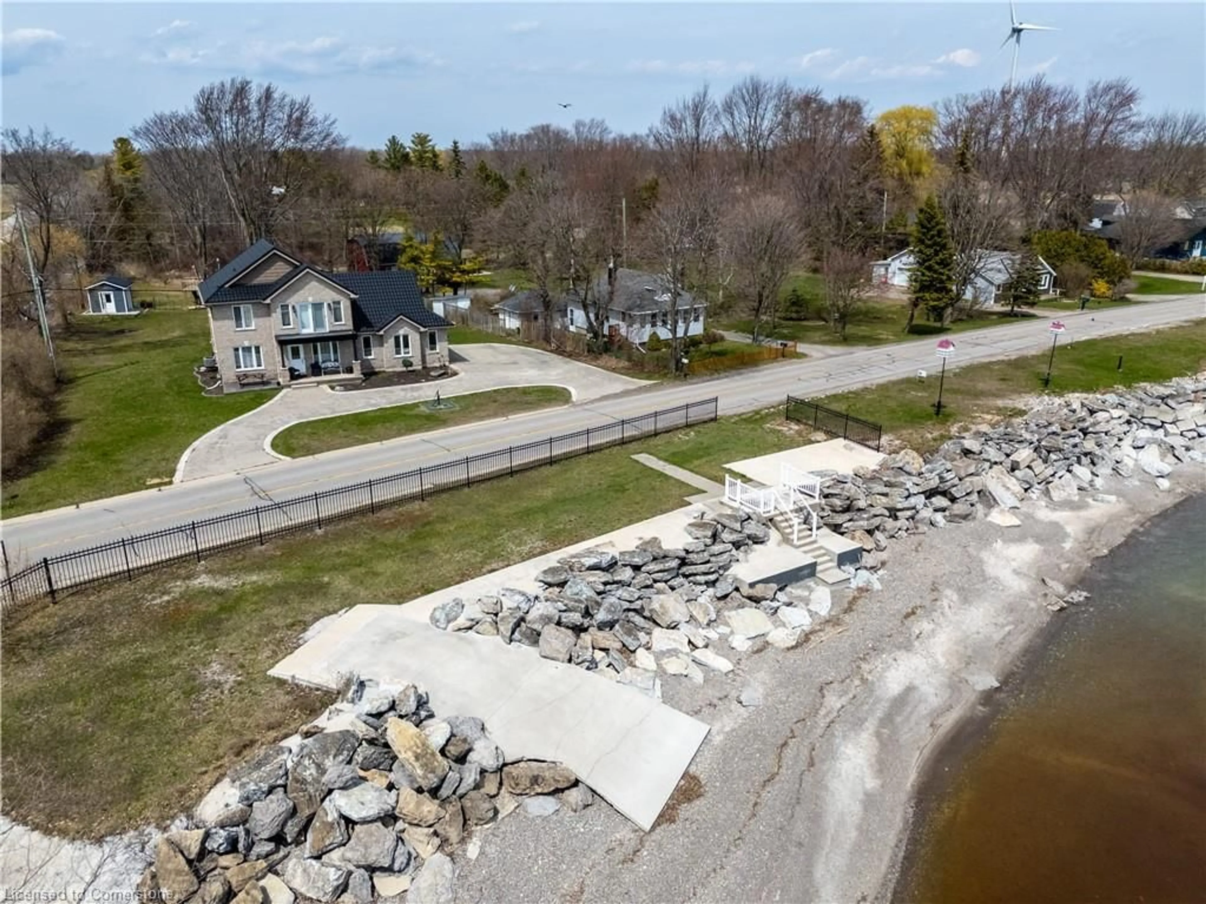 A pic from outside/outdoor area/front of a property/back of a property/a pic from drone, water/lake/river/ocean view for 2801 North Shore Dr, Lowbanks Ontario N0A 1K0
