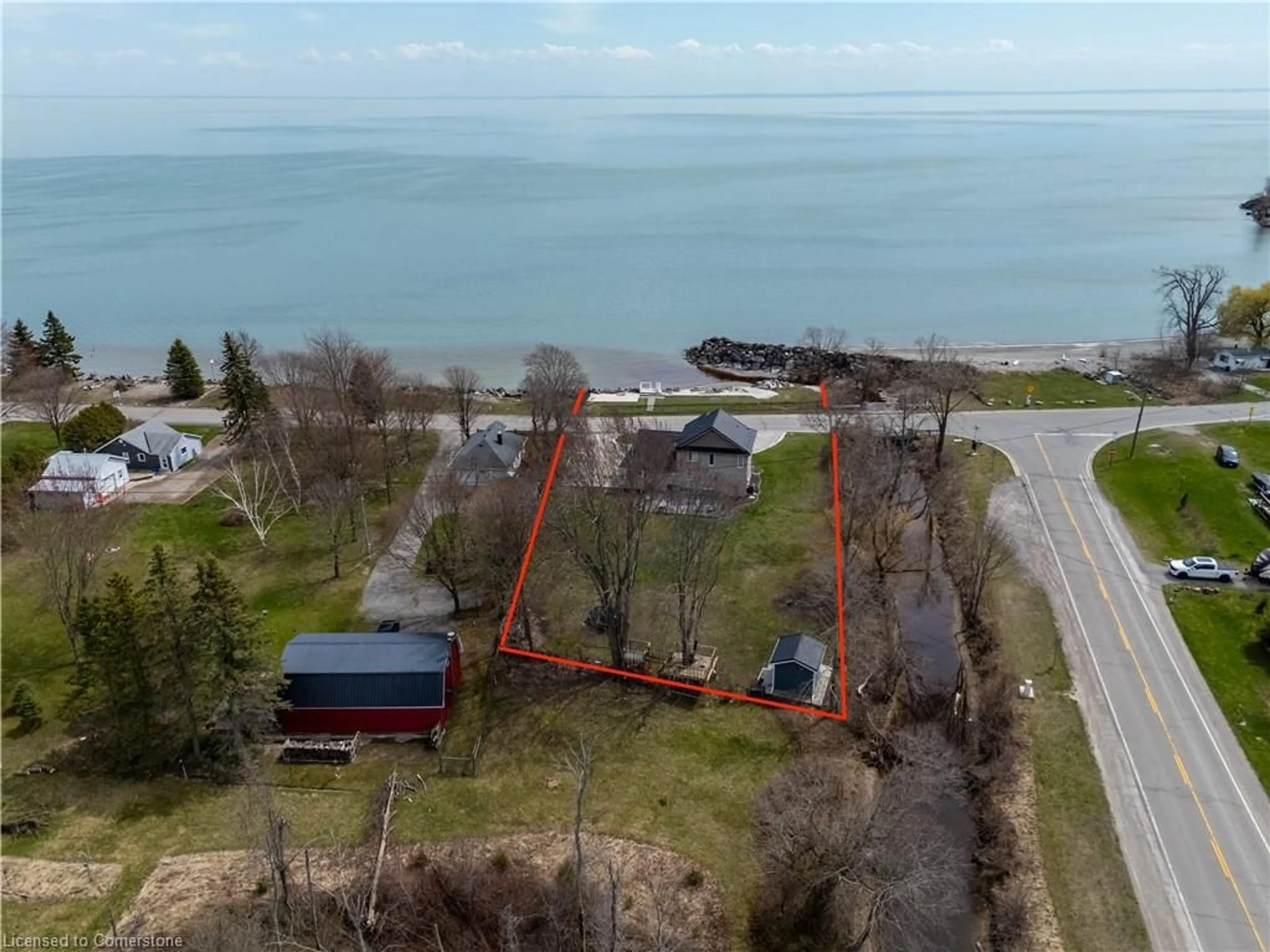 A pic from outside/outdoor area/front of a property/back of a property/a pic from drone, water/lake/river/ocean view for 2801 North Shore Dr, Lowbanks Ontario N0A 1K0
