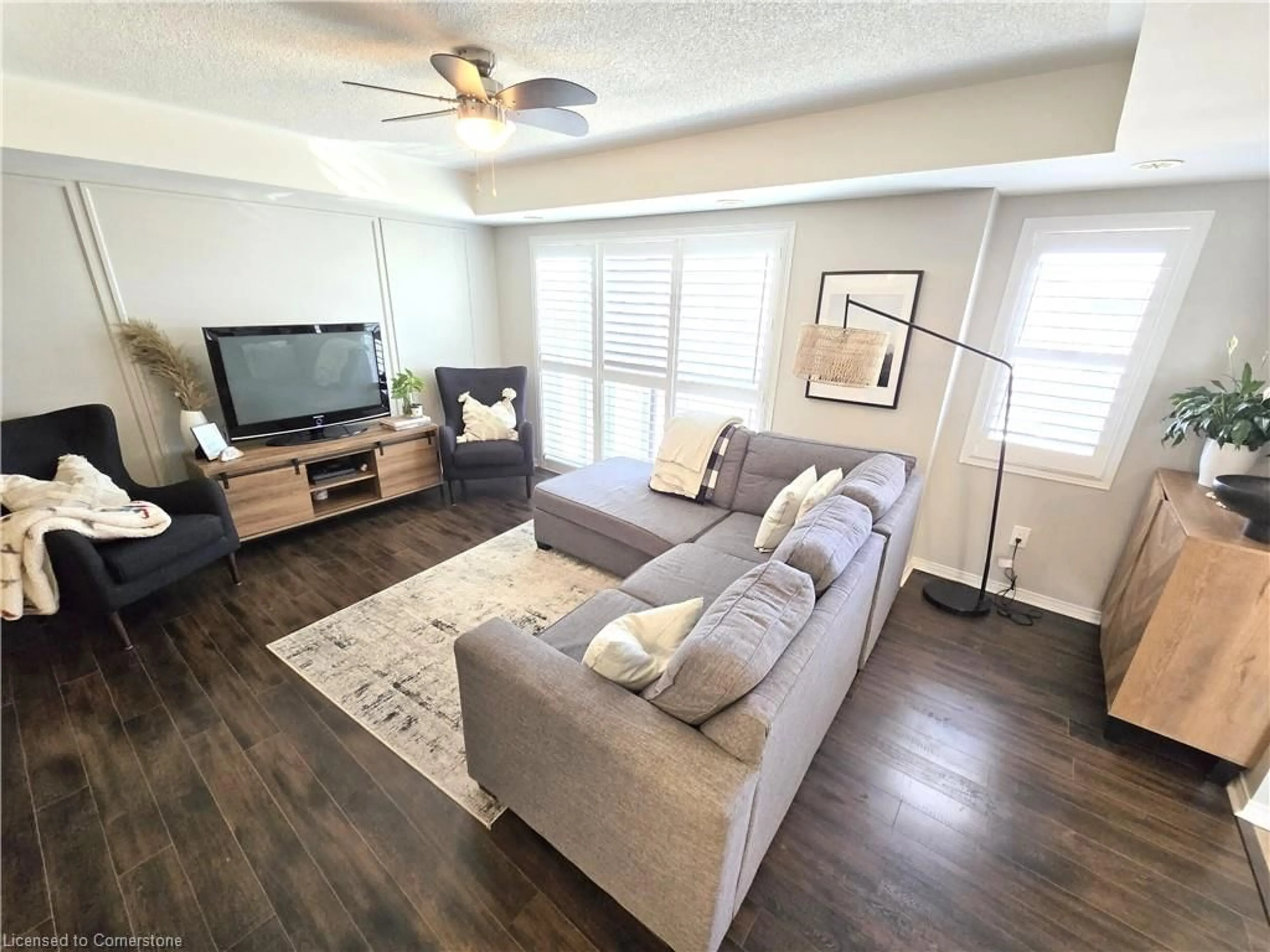 Living room with furniture, wood/laminate floor for 60 Fairwood Cir #79, Brampton Ontario L6R 0Y6