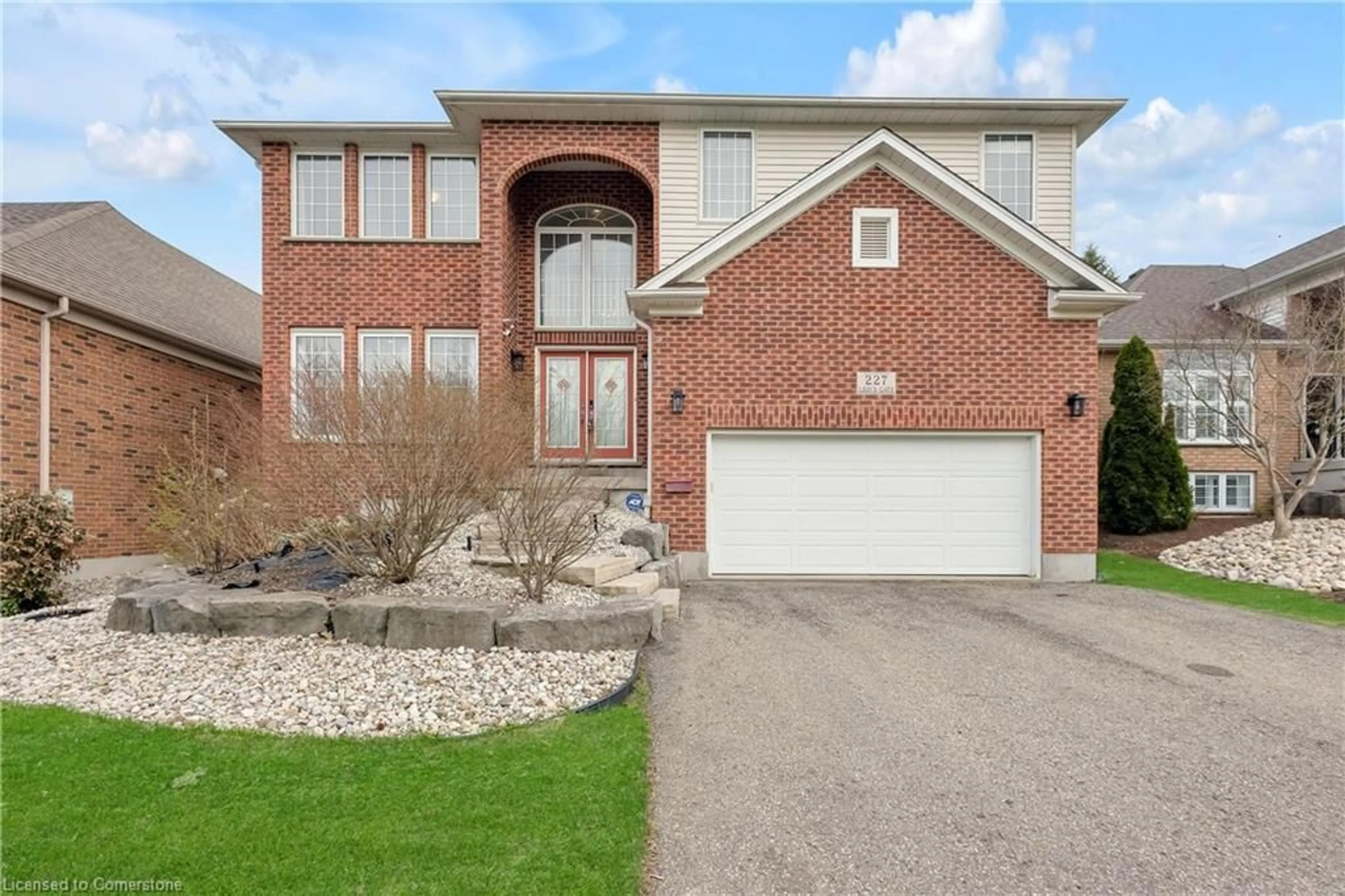 Home with brick exterior material, street for 227 The Lions Gate, Waterloo Ontario N2L 6M6