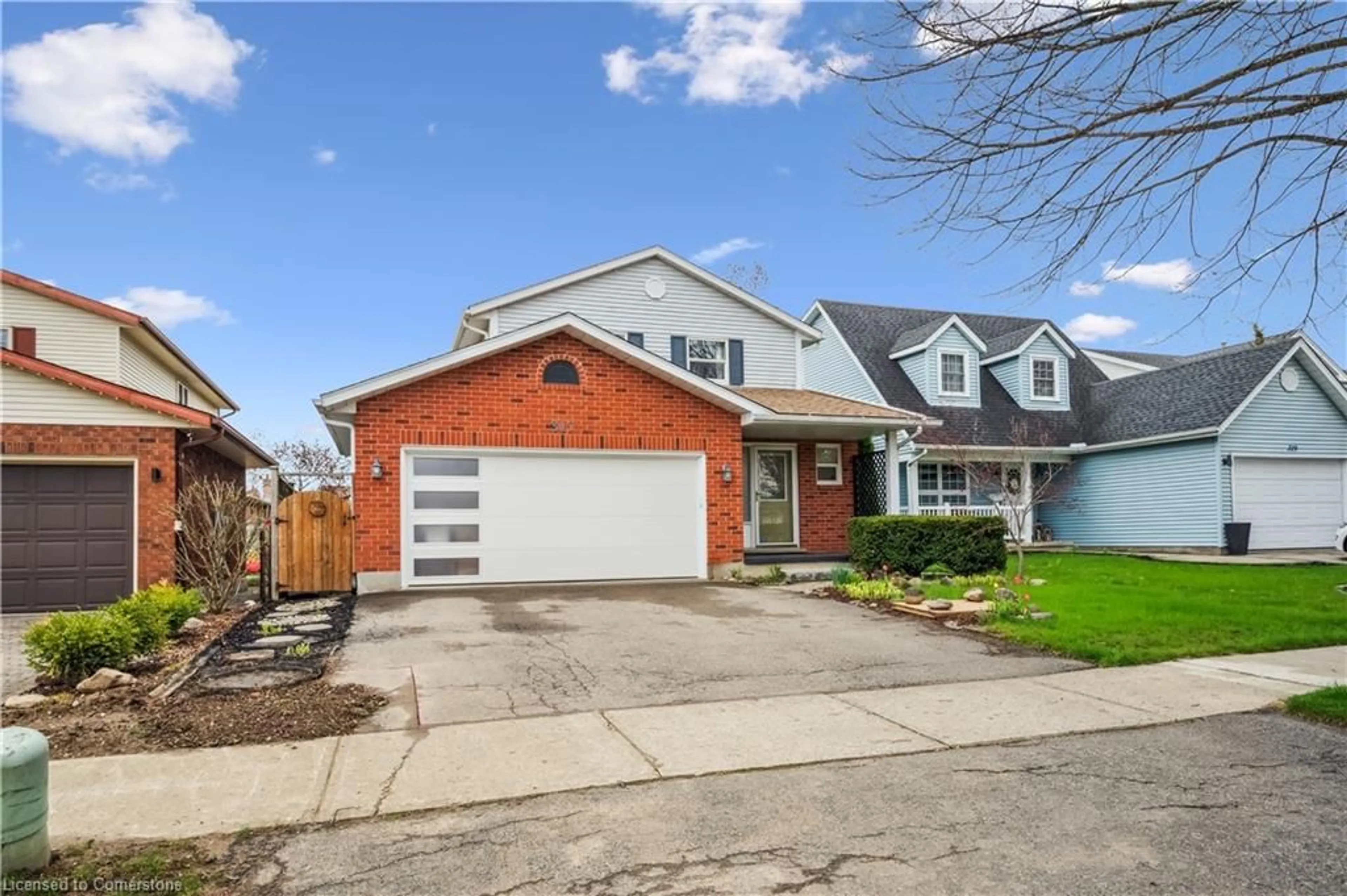 Home with brick exterior material, street for 317 Bushview Cres, Waterloo Ontario N2V 2A6