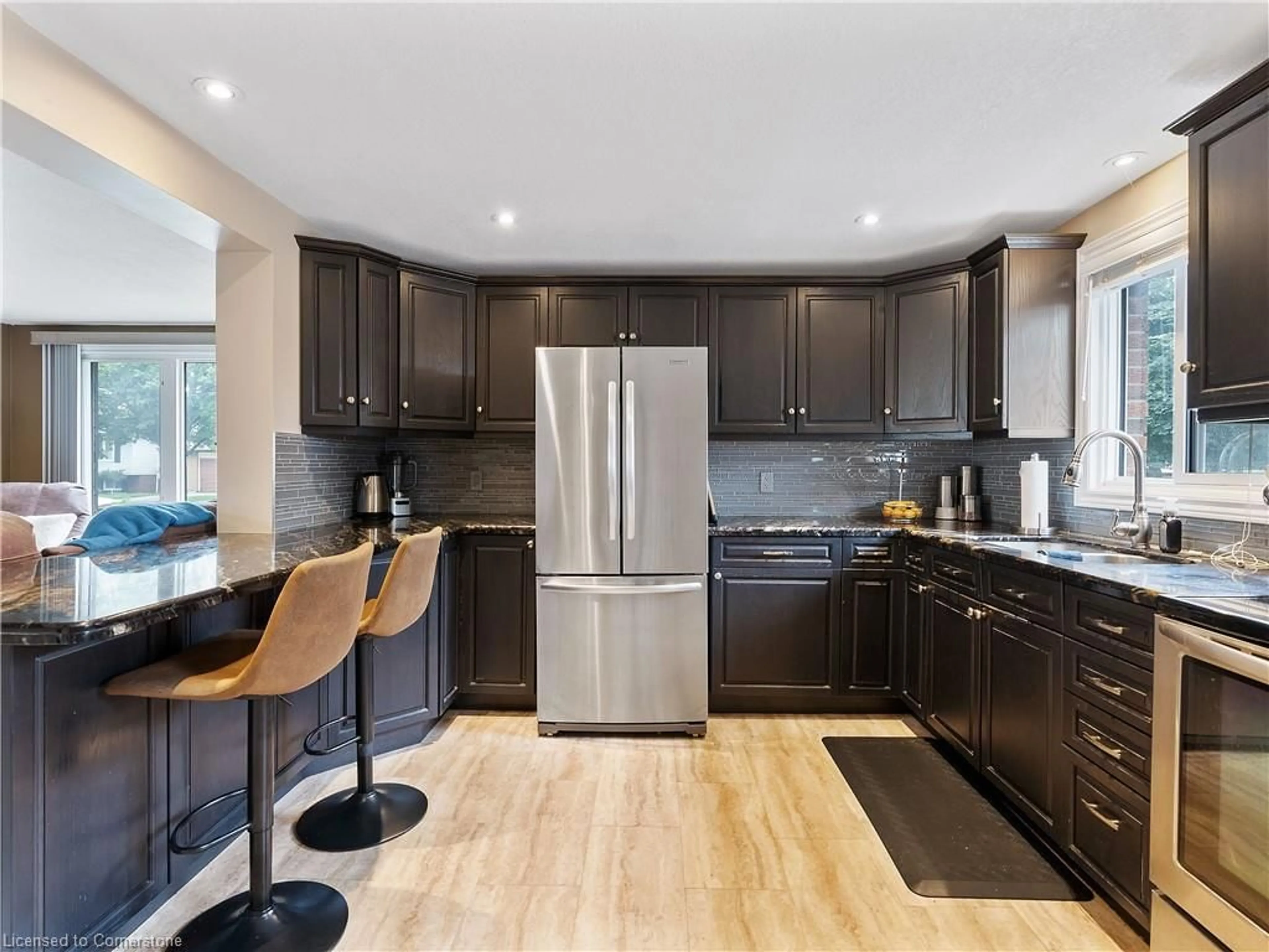 Open concept kitchen, wood/laminate floor for 20 Miller Cres, Simcoe Ontario N3Y 4R1