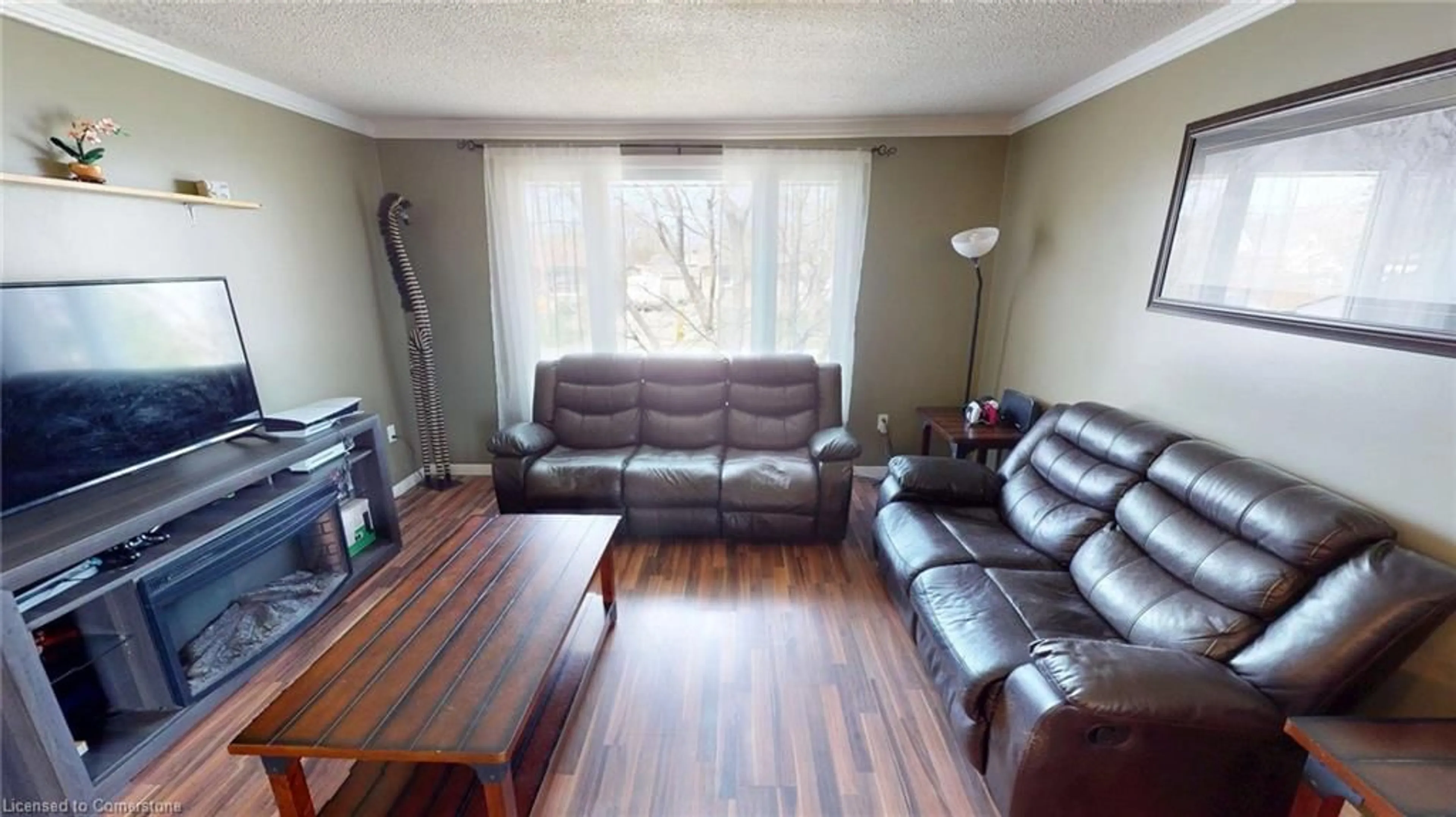 Living room with furniture, wood/laminate floor for 12 Silverdale Dr, St. Catharines Ontario L2M 3N1