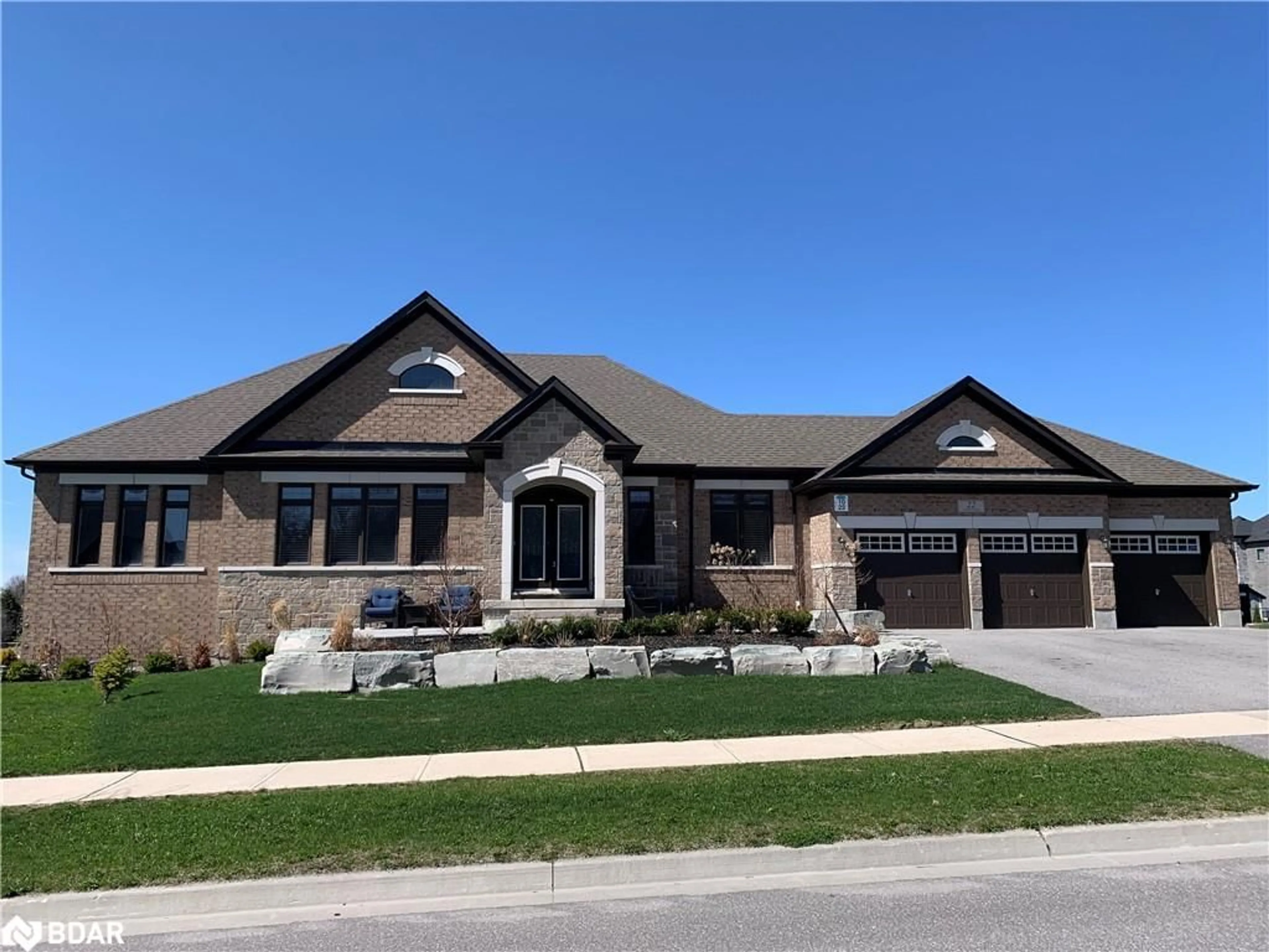 Home with brick exterior material, street for 22 Stewart Crescent, Essa Ontario L0L 2N0