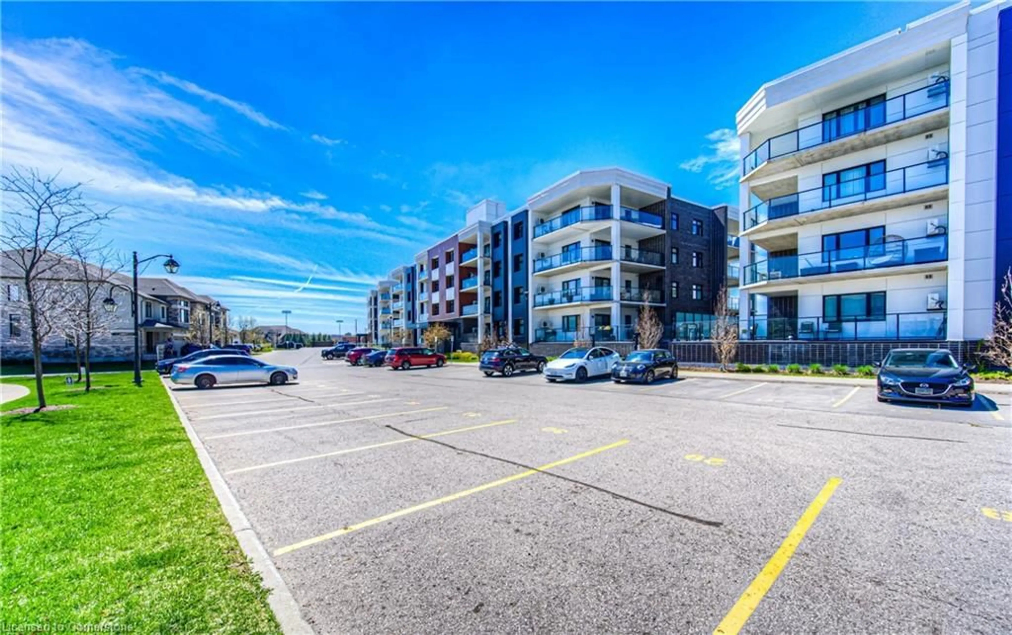 A pic from outside/outdoor area/front of a property/back of a property/a pic from drone, street for 247 Grey Silo Rd #205, Waterloo Ontario N2K 0G7