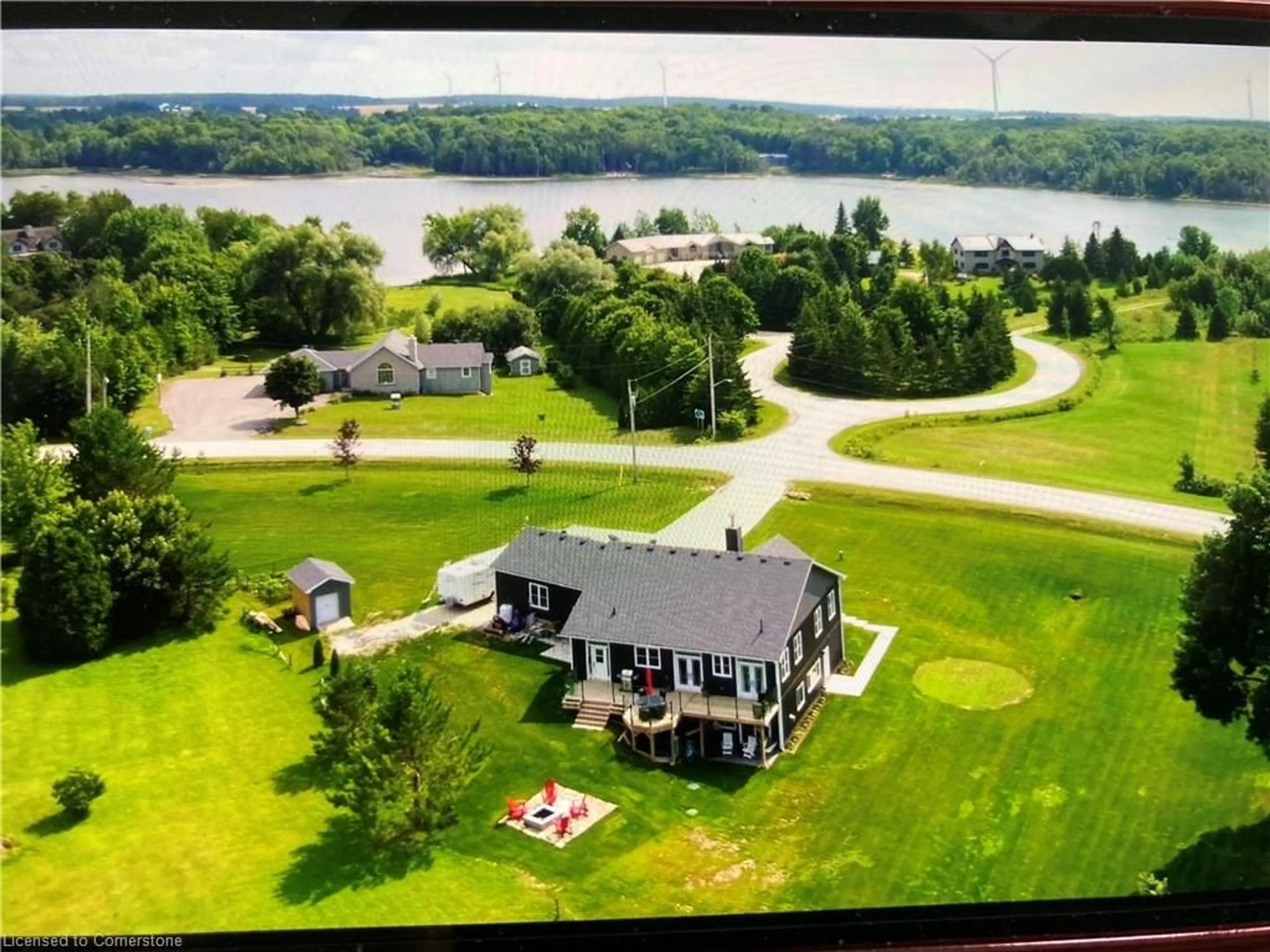 A pic from outside/outdoor area/front of a property/back of a property/a pic from drone, water/lake/river/ocean view for 167 Brewster Lake Road, Singhampton Ontario N0C 1M0