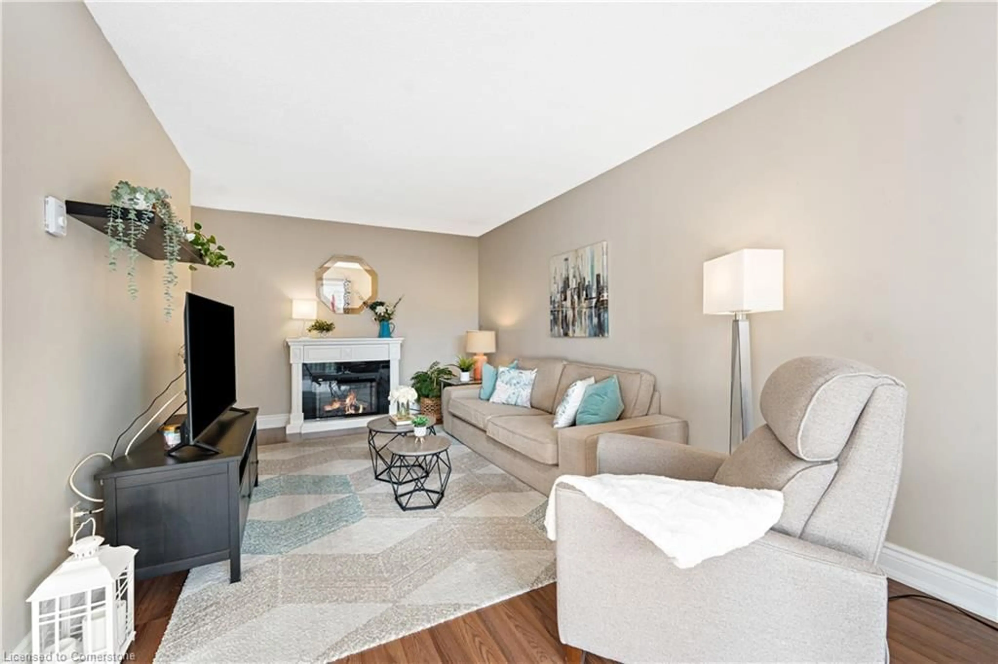 Living room with furniture, unknown for 4209 Hixon St #308, Beamsville Ontario L3J 0K2