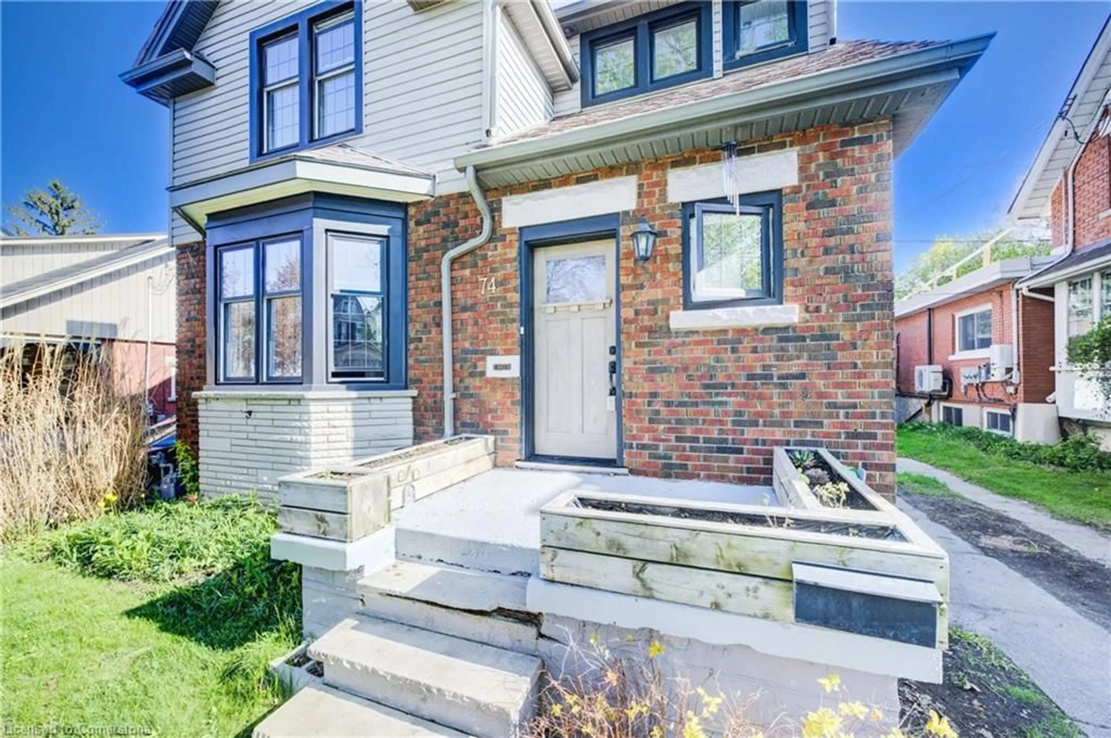 Home with brick exterior material, street for 74 Homewood Ave, Kitchener Ontario N2M 1W9