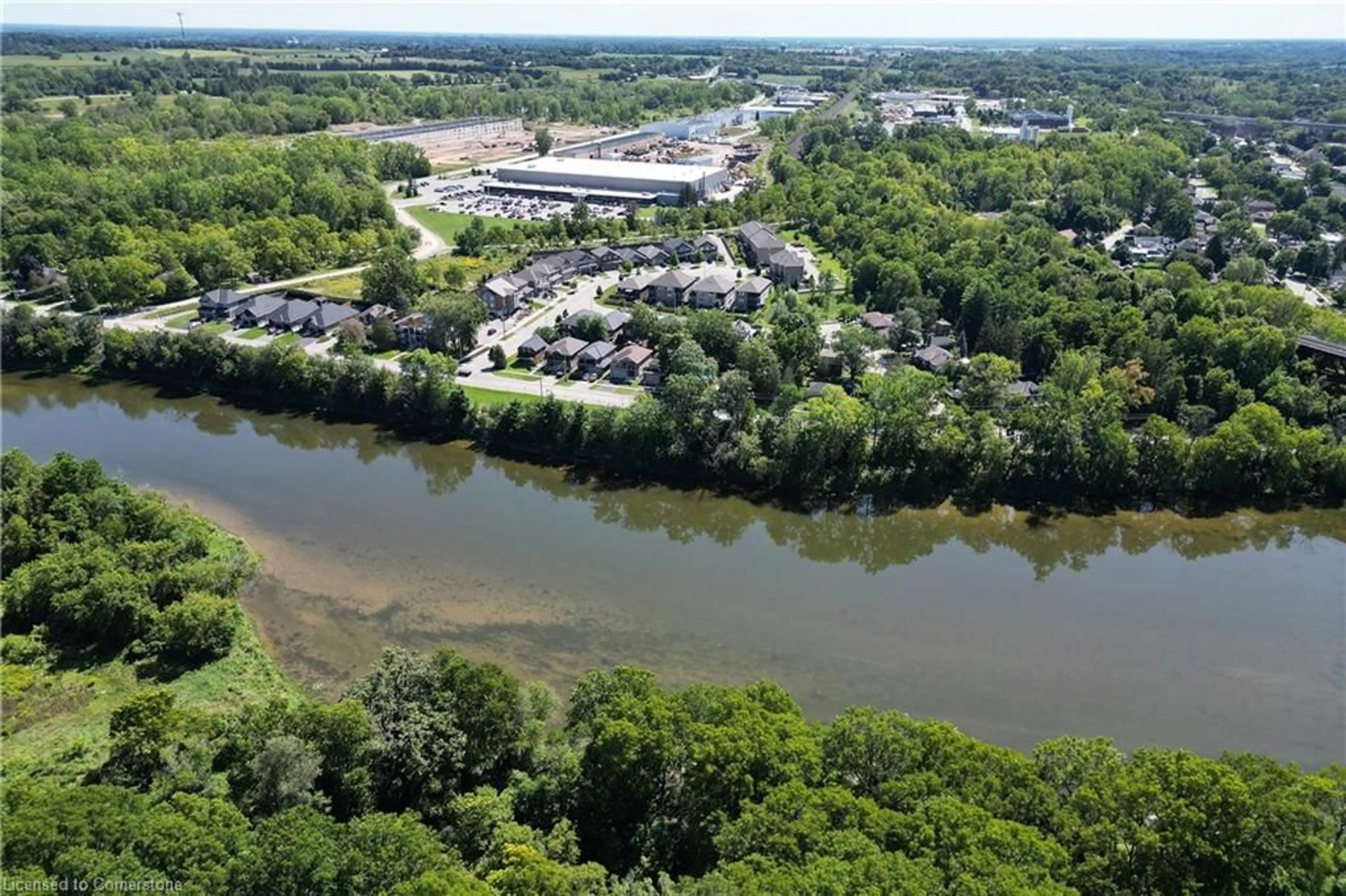 A pic from outside/outdoor area/front of a property/back of a property/a pic from drone, water/lake/river/ocean view for 199 Grand River St, Paris Ontario N3L 2N2