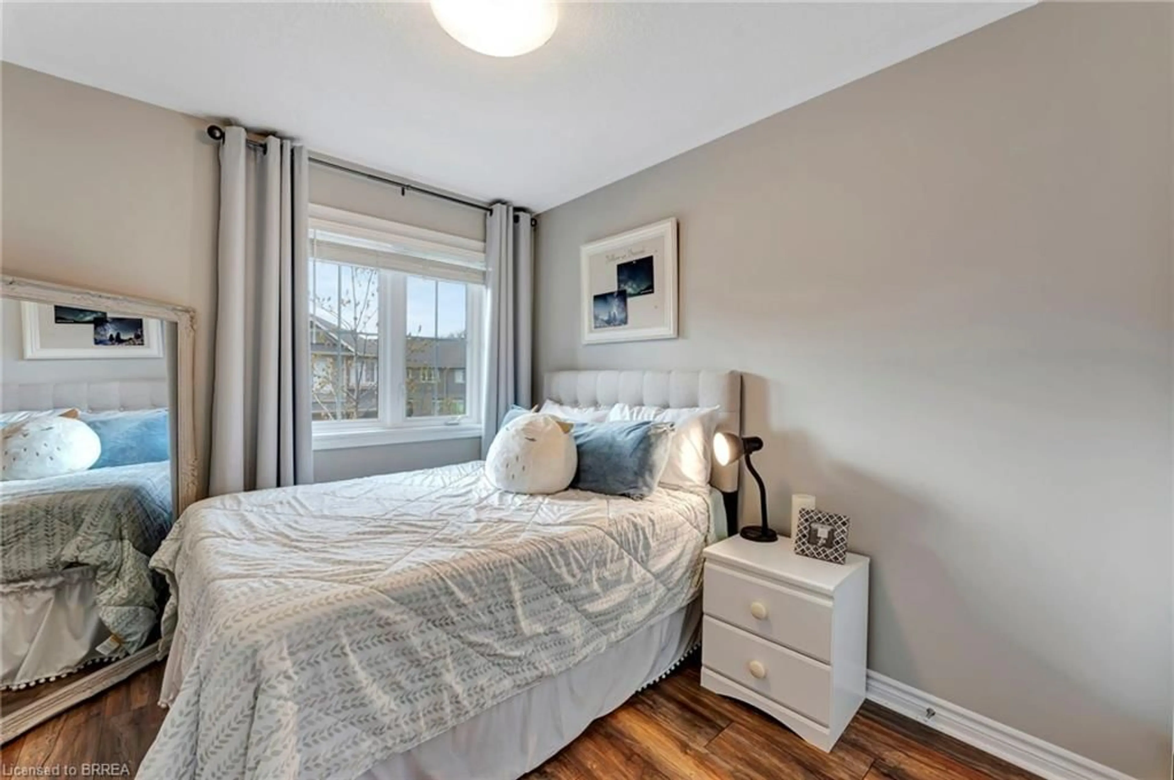 Bedroom with bed, wood/laminate floor for 80 Willow St #33, Paris Ontario N3L 2K6