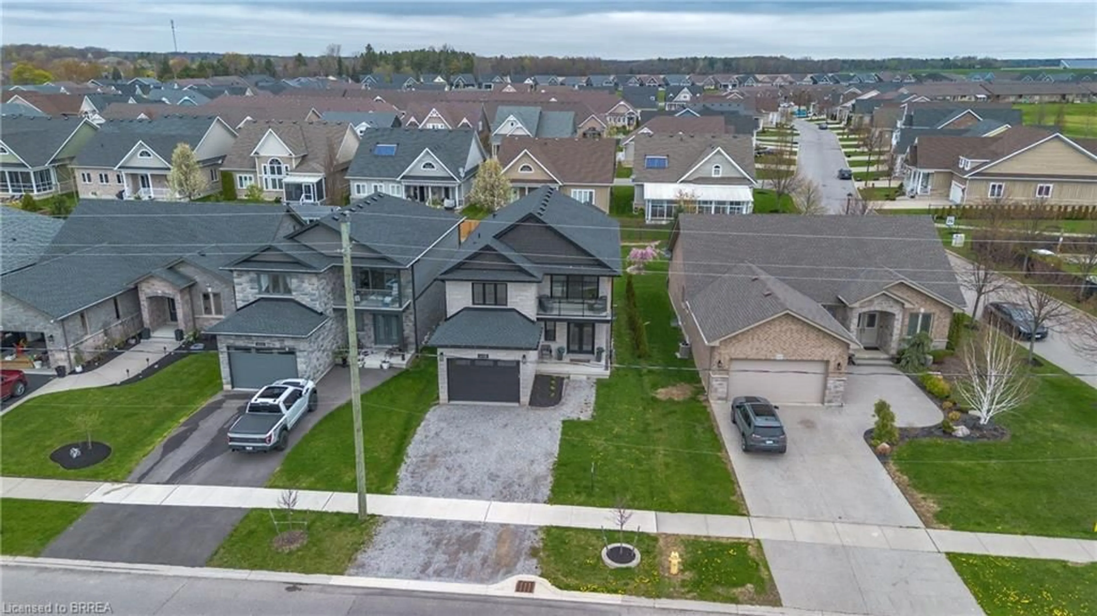 A pic from outside/outdoor area/front of a property/back of a property/a pic from drone, street for 145 New Lakeshore Rd, Port Dover Ontario N0A 1N3