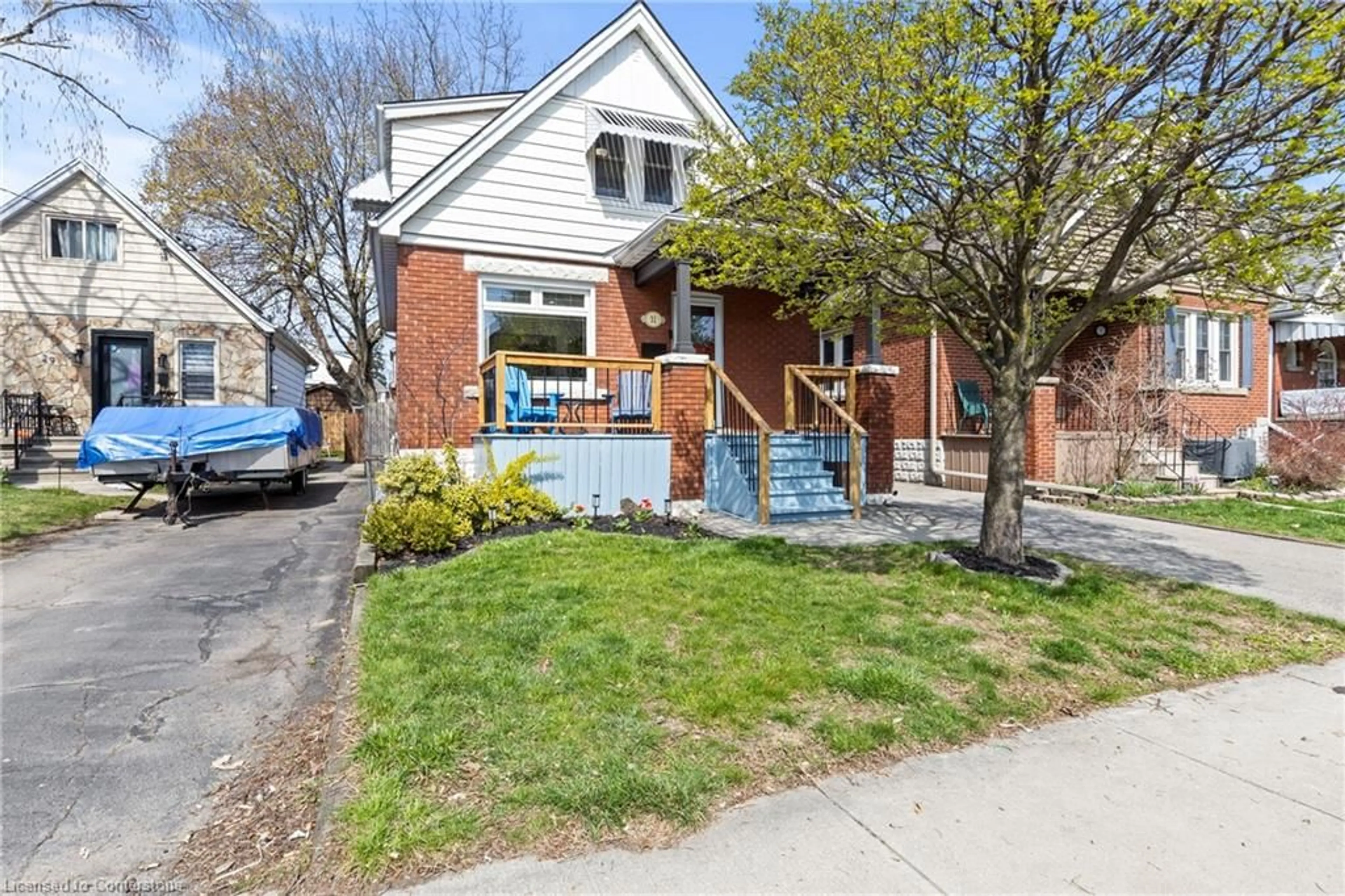 Home with brick exterior material, street for 31 Barons Ave, Hamilton Ontario L8H 5A3