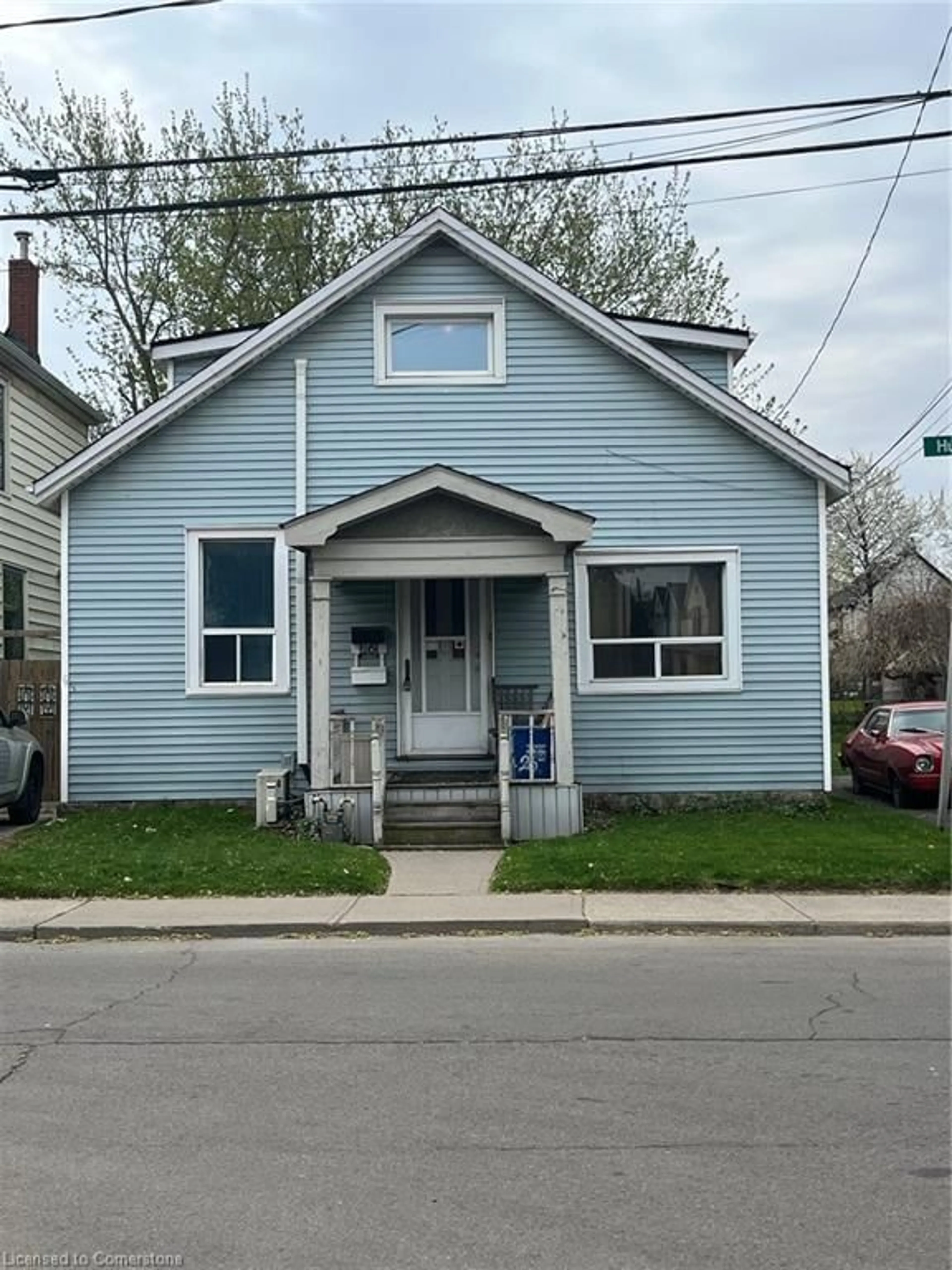 Home with vinyl exterior material, street for 26 Huron St, Hamilton Ontario L8L 2S2