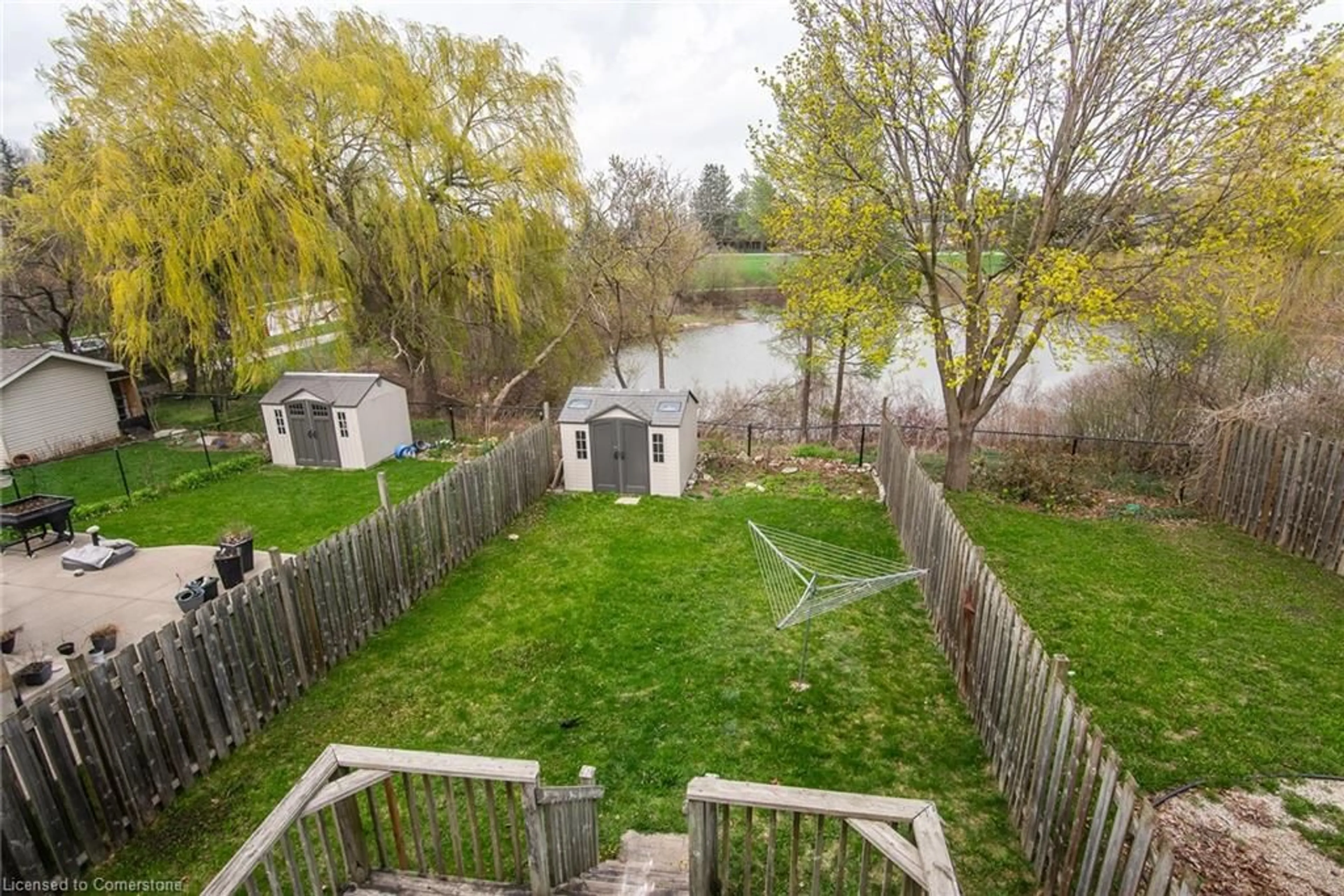 A pic from outside/outdoor area/front of a property/back of a property/a pic from drone, water/lake/river/ocean view for 608 Royal Beech Dr #A, Waterloo Ontario N2T 2K3