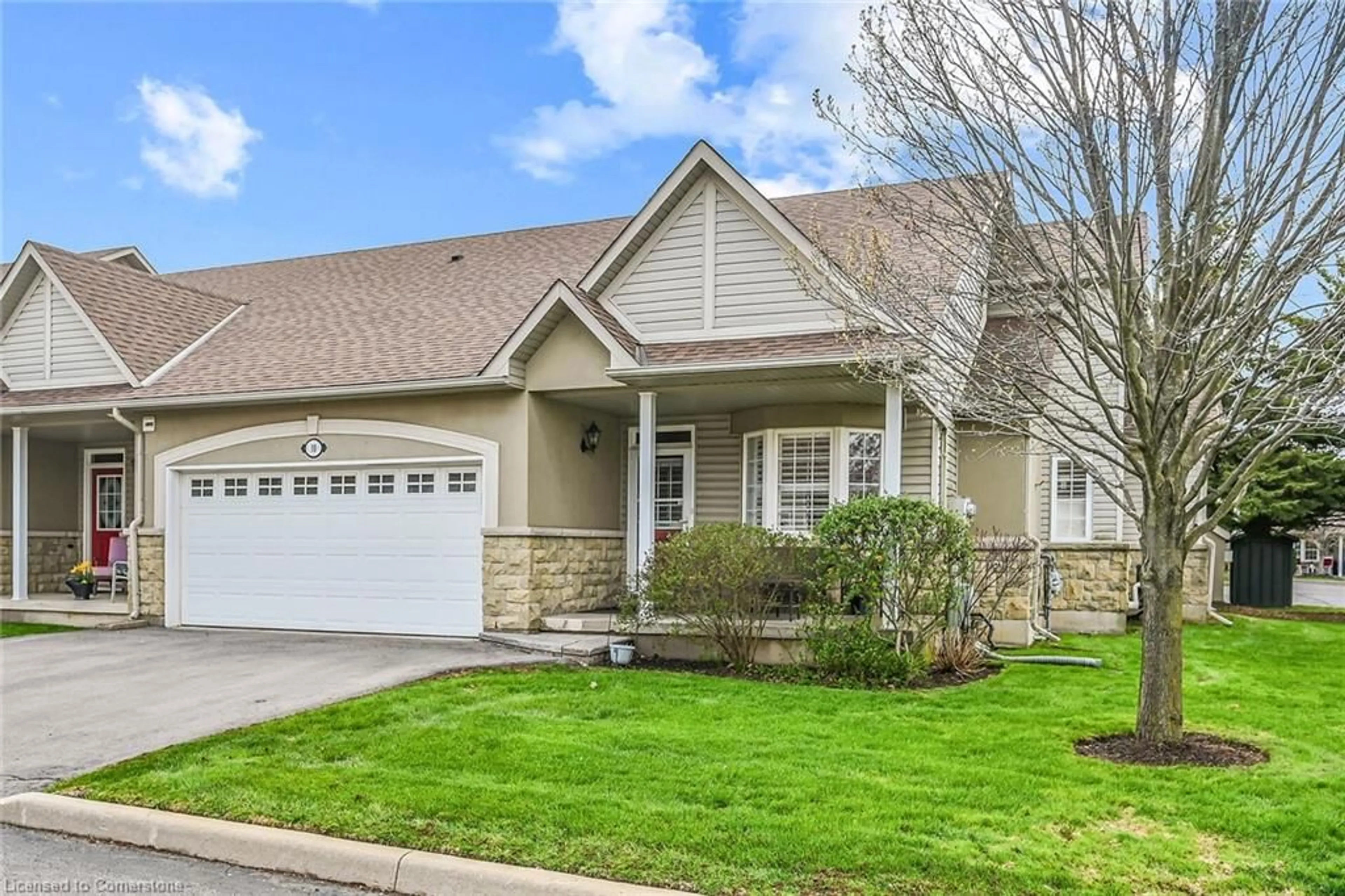 Home with vinyl exterior material, street for 212 Stonehenge Dr #10, Ancaster Ontario L9K 1N5