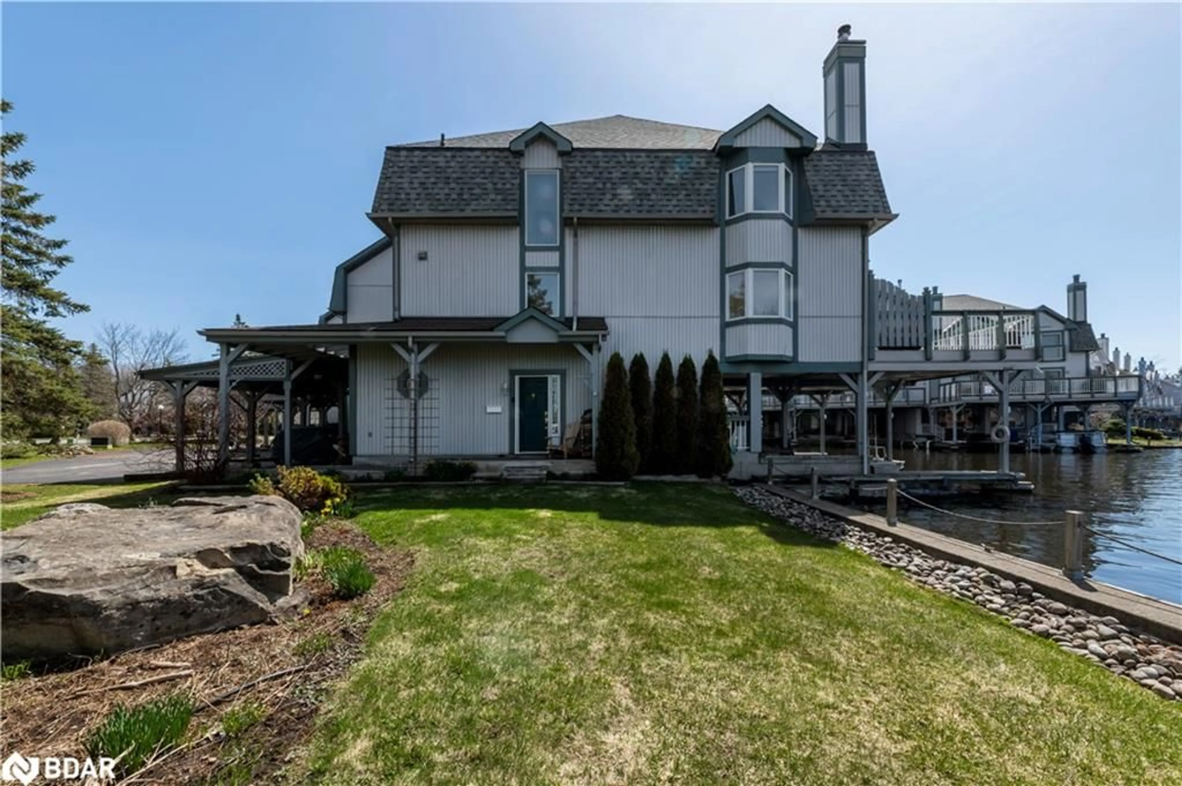 A pic from outside/outdoor area/front of a property/back of a property/a pic from drone, unknown for 30 Laguna Pky #16, Brechin Ontario L0K 1B0