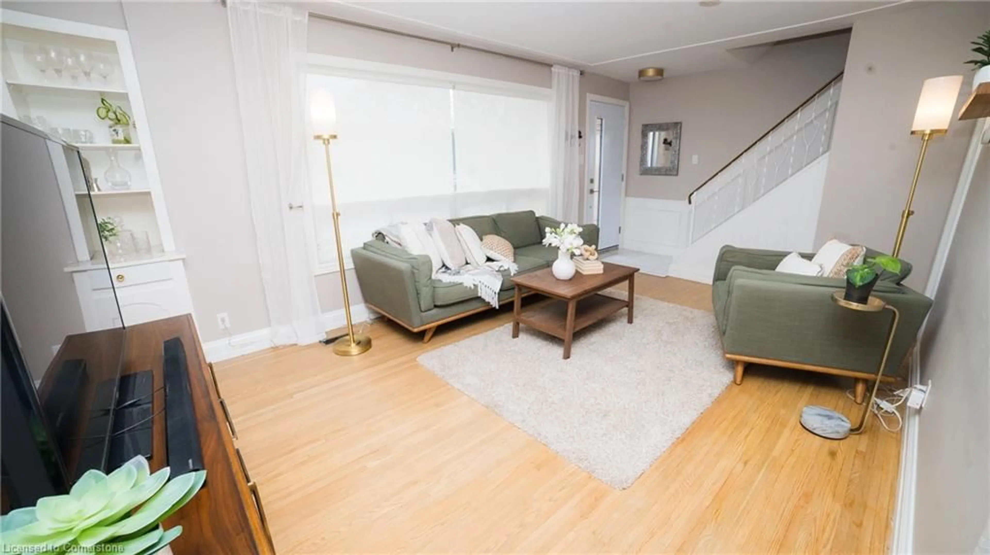 Living room with furniture, wood/laminate floor for 48 Falesy Ave, Kitchener Ontario N2A 1N9