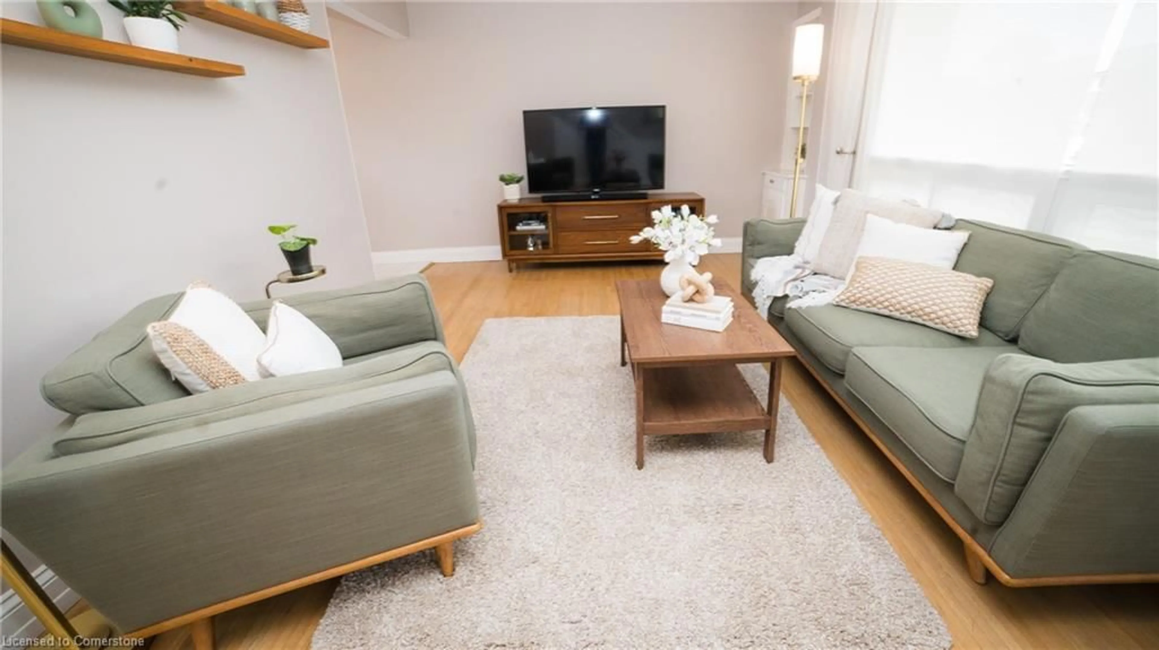Living room with furniture, wood/laminate floor for 48 Falesy Ave, Kitchener Ontario N2A 1N9