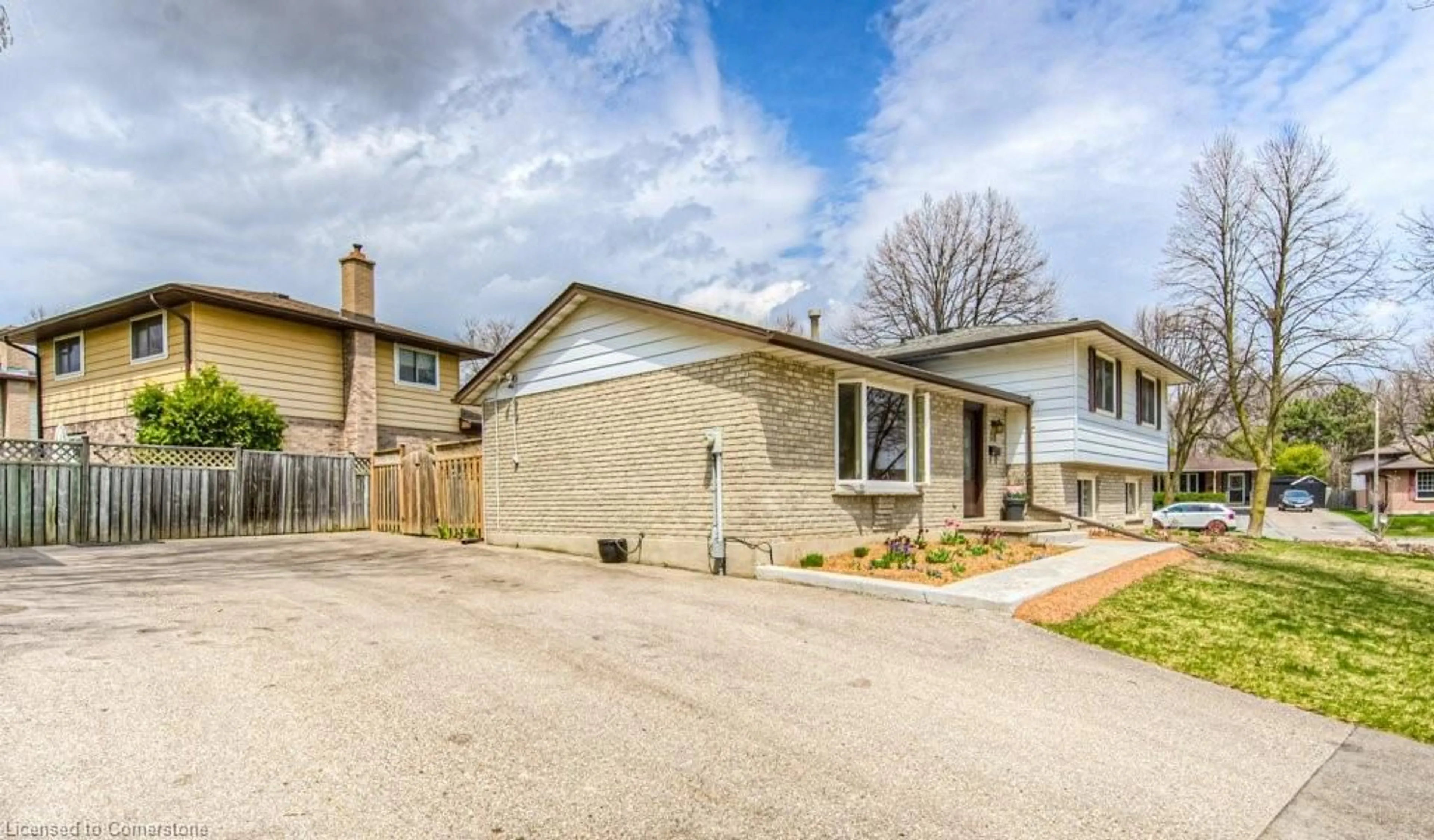 Home with brick exterior material, street for 111 Martinglen Cres, Kitchener Ontario N2E 2A3