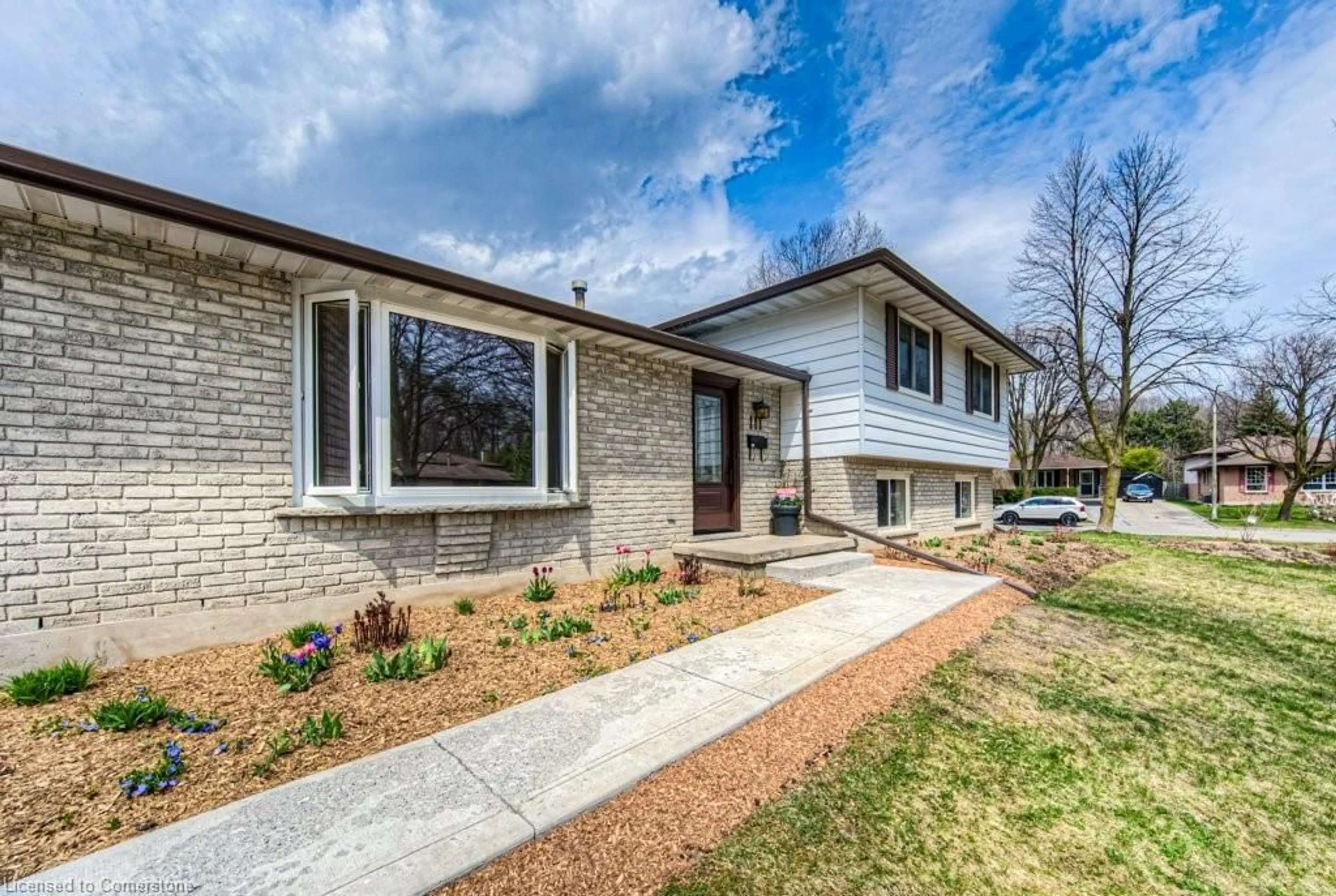 Home with brick exterior material, street for 111 Martinglen Cres, Kitchener Ontario N2E 2A3