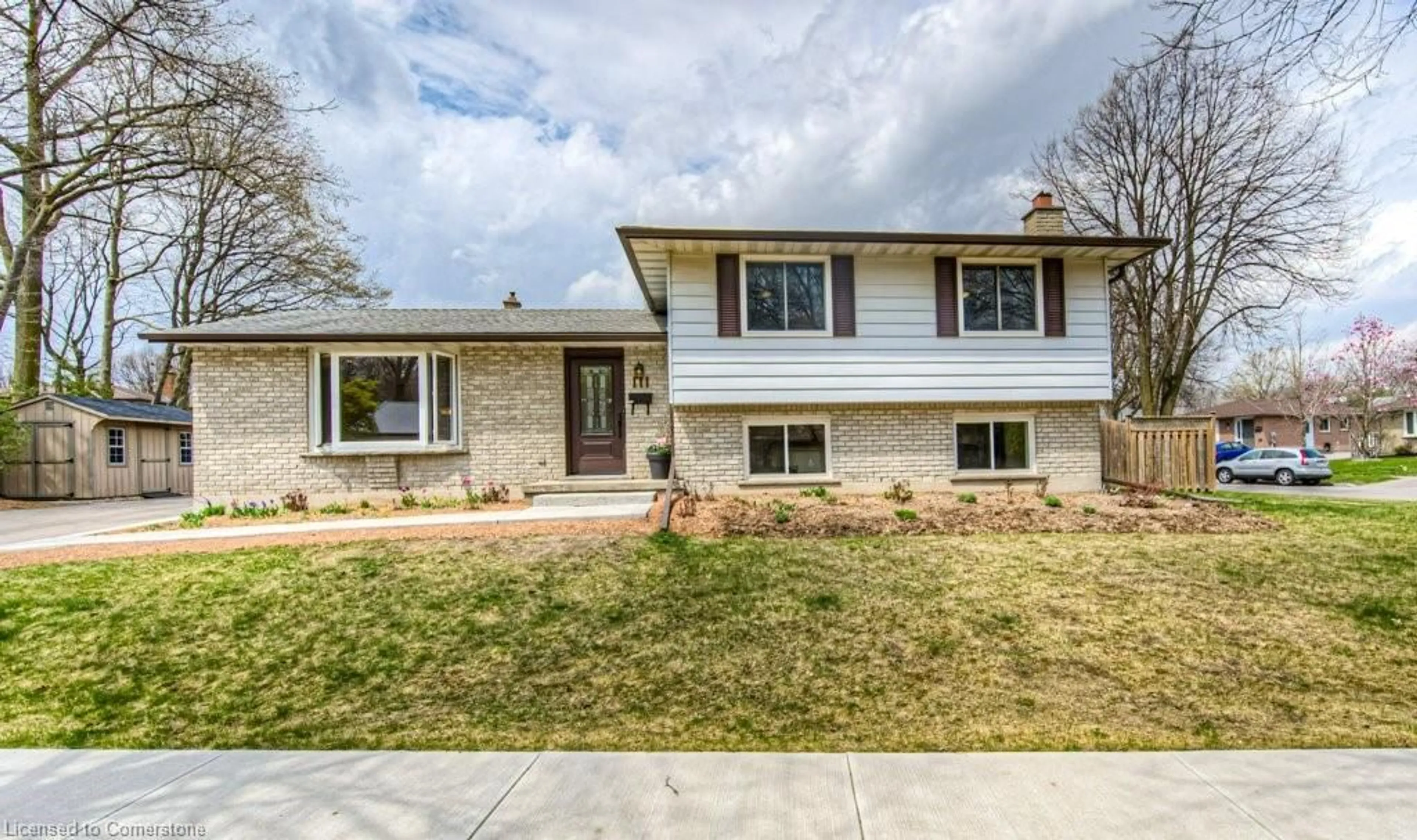 Home with brick exterior material, street for 111 Martinglen Cres, Kitchener Ontario N2E 2A3