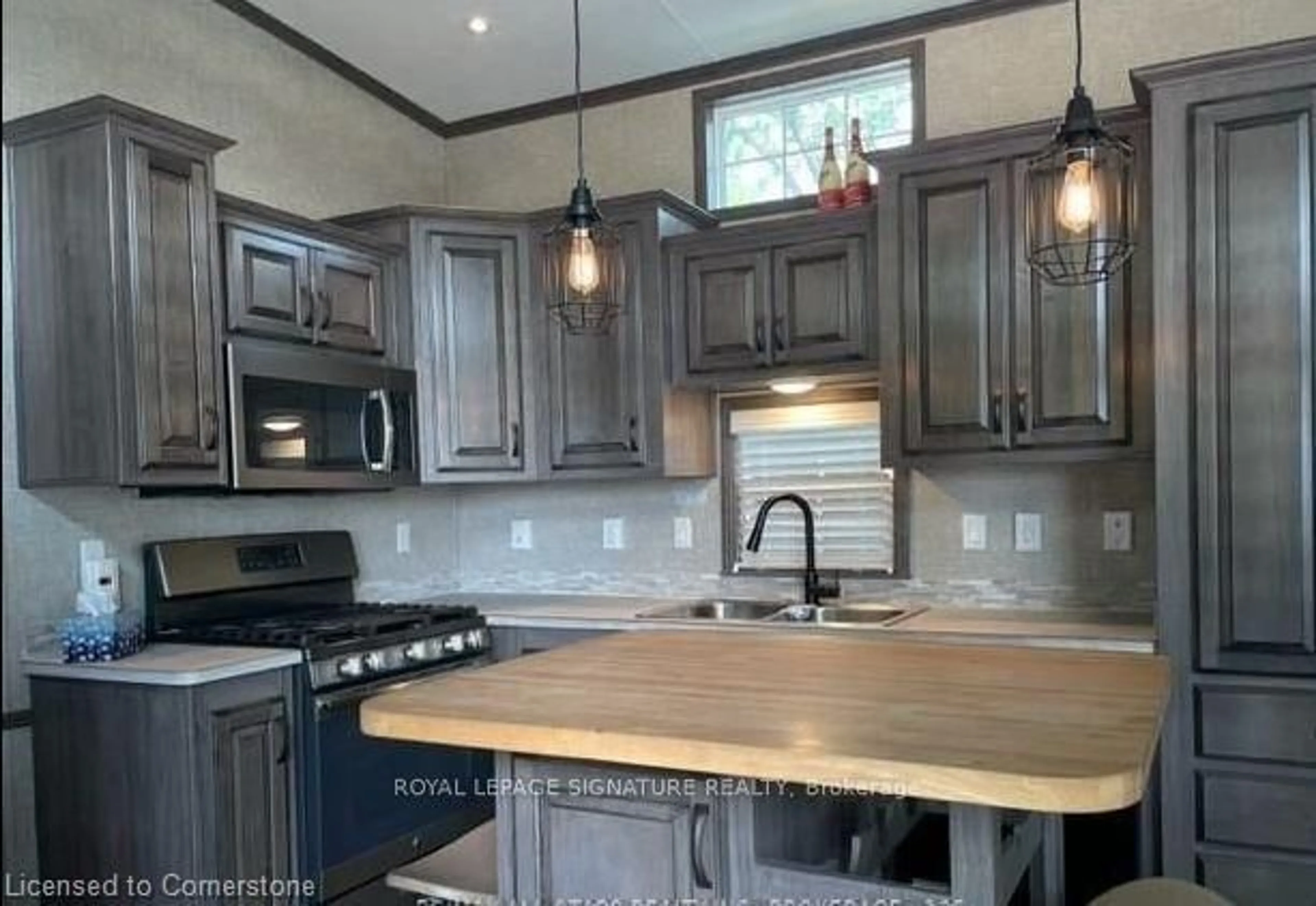 Open concept kitchen, wood/laminate floor for 2152 County 36 Rd #30, Kawartha Lakes Ontario K0M 1L0