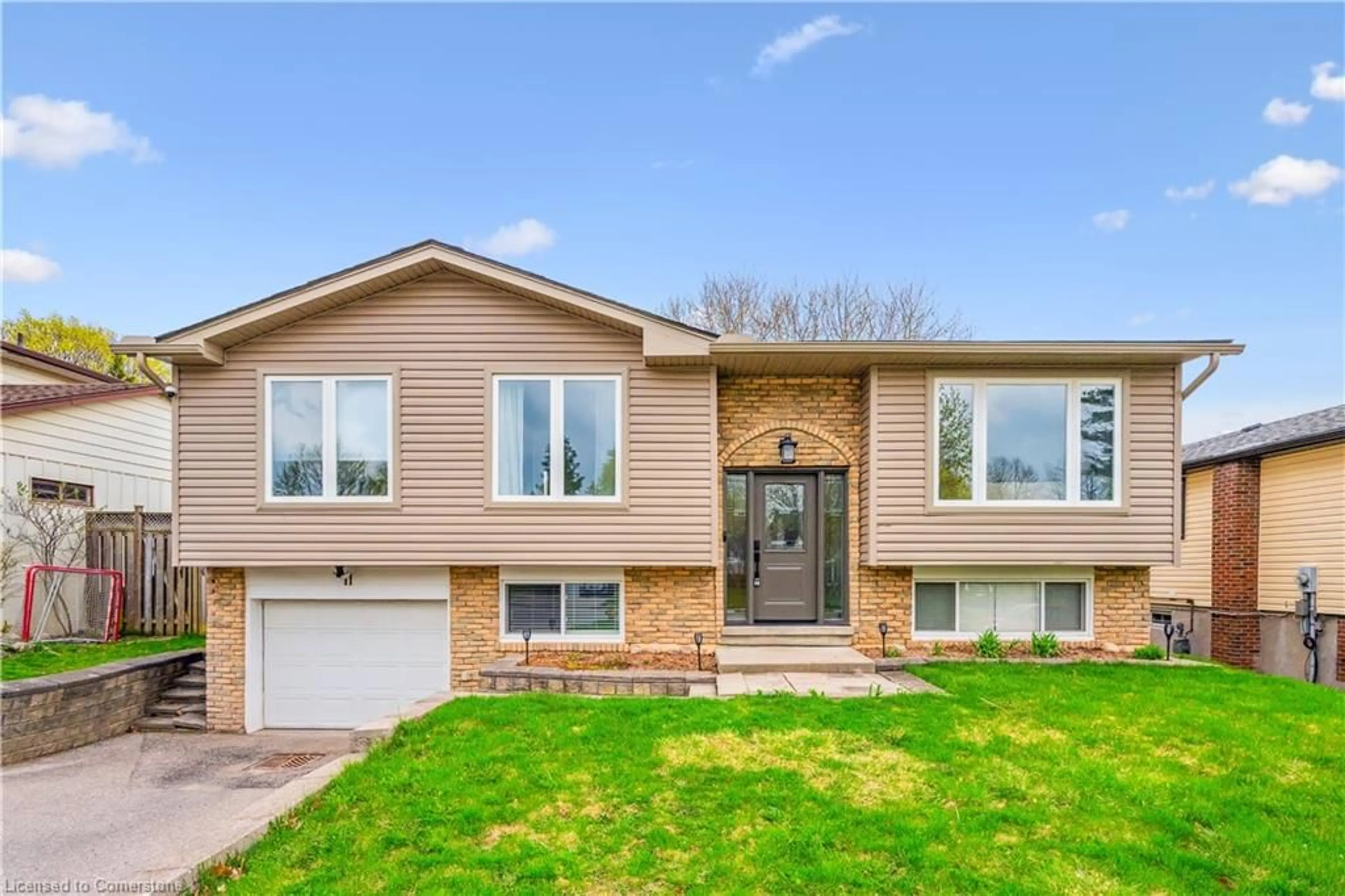 Home with vinyl exterior material, street for 11 Fairmeadow Dr, Guelph Ontario N1H 6X2