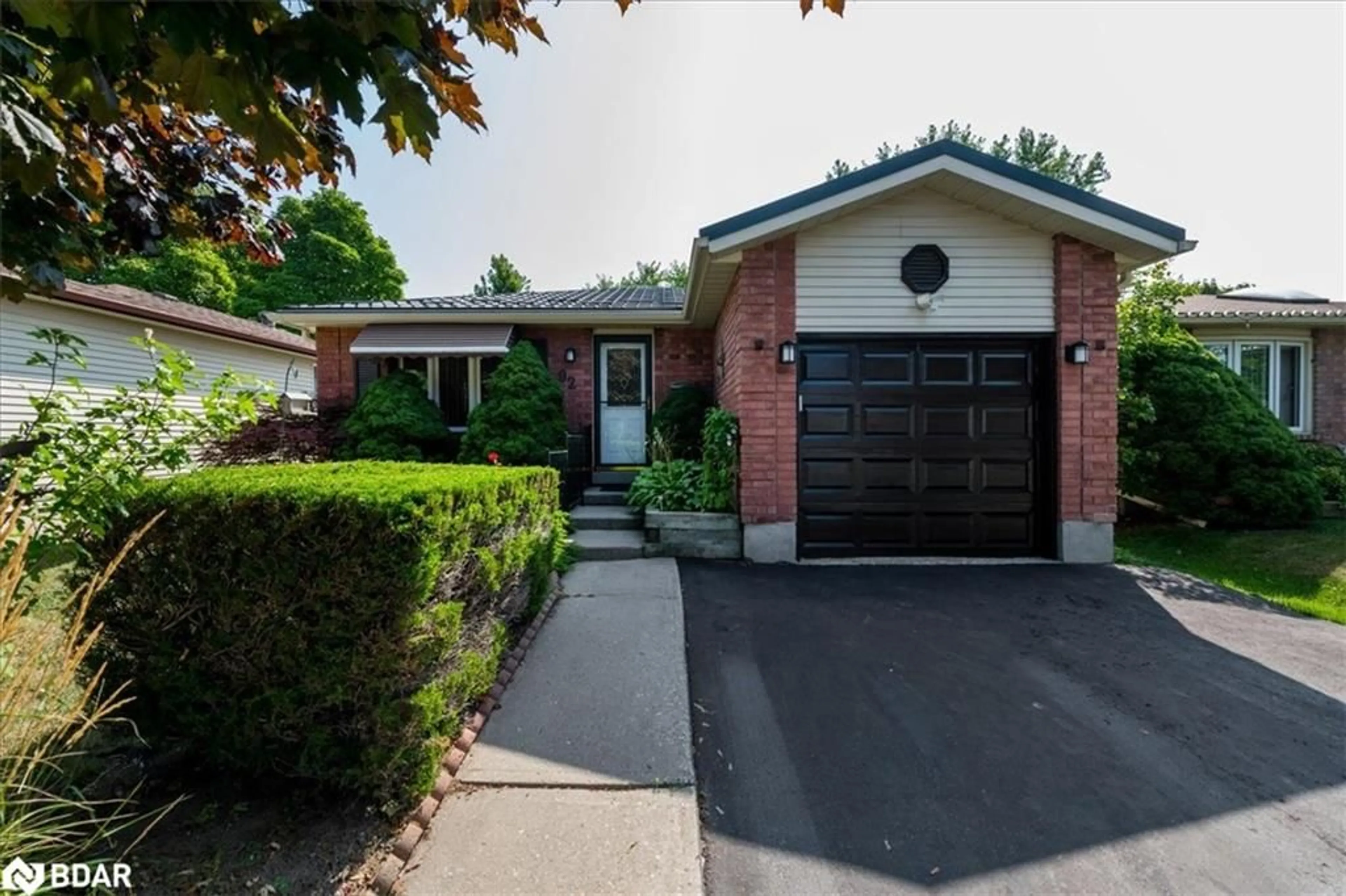 Home with brick exterior material, street for 92 Hickling Trail, Barrie Ontario L4M 5T3