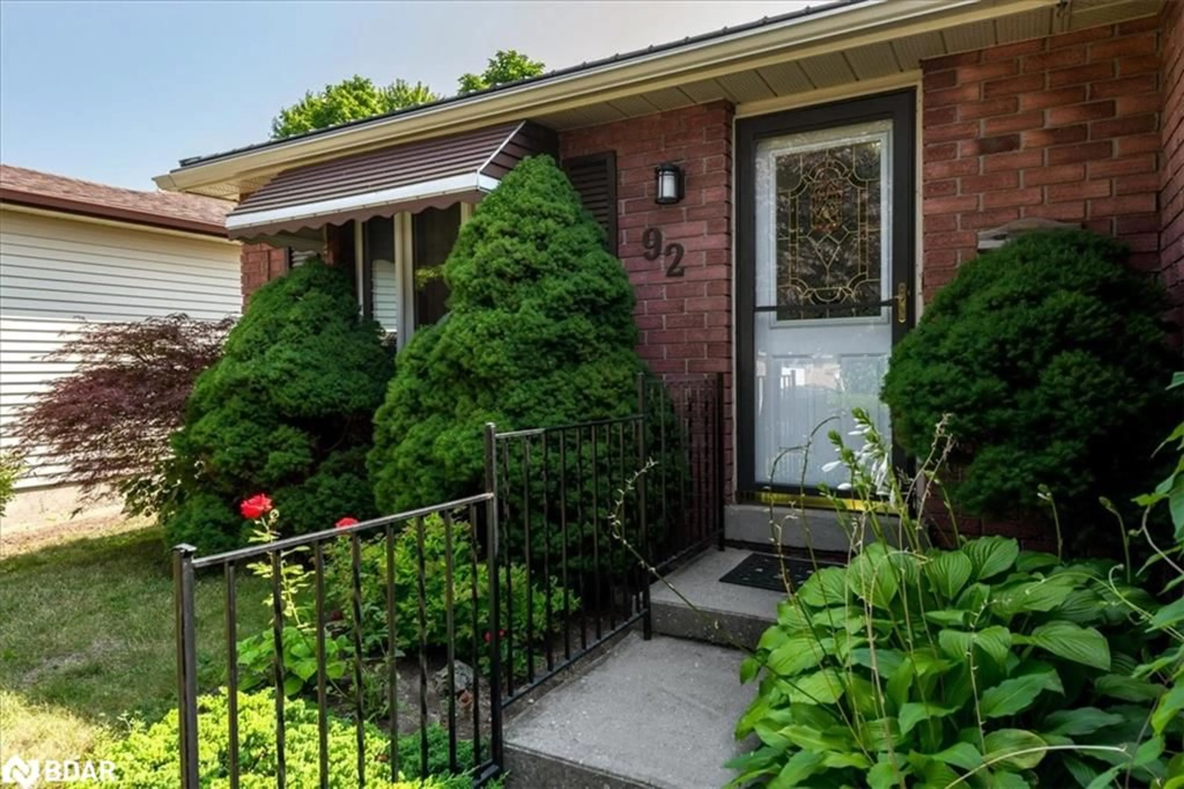 Home with brick exterior material, street for 92 Hickling Trail, Barrie Ontario L4M 5T3